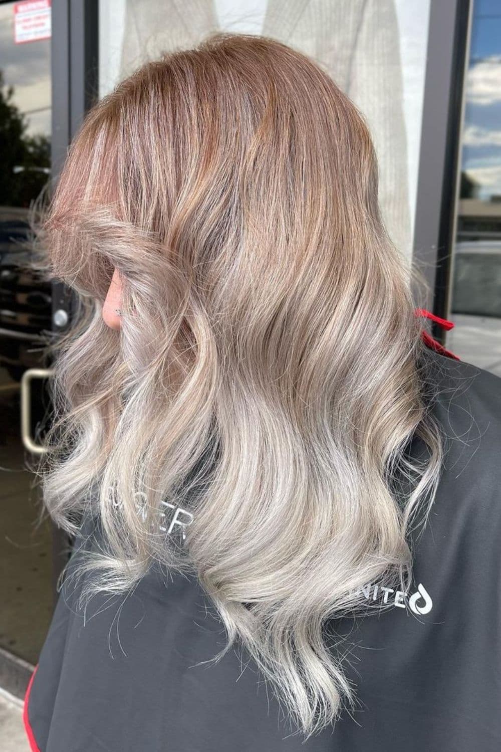 A woman with a platinum blonde ombre hair.