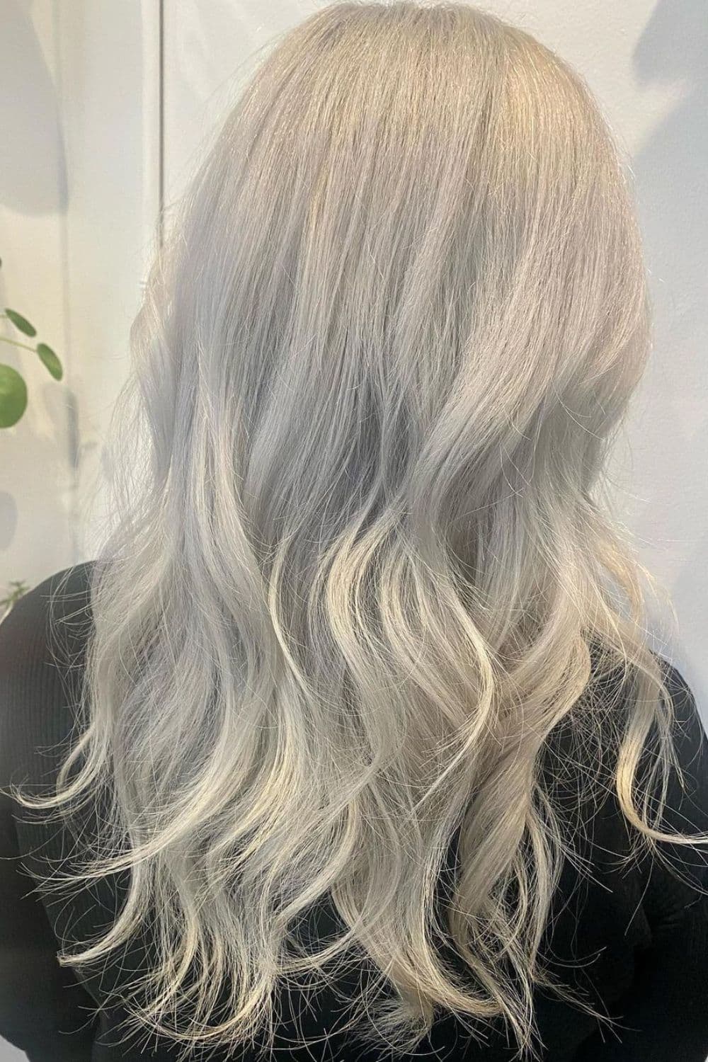 A woman with long platinum silver hair.