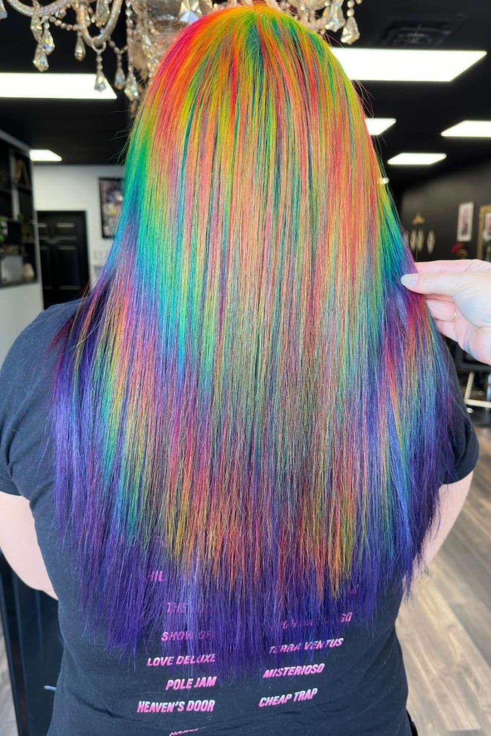 A woman with long straight rainbow prism hair.