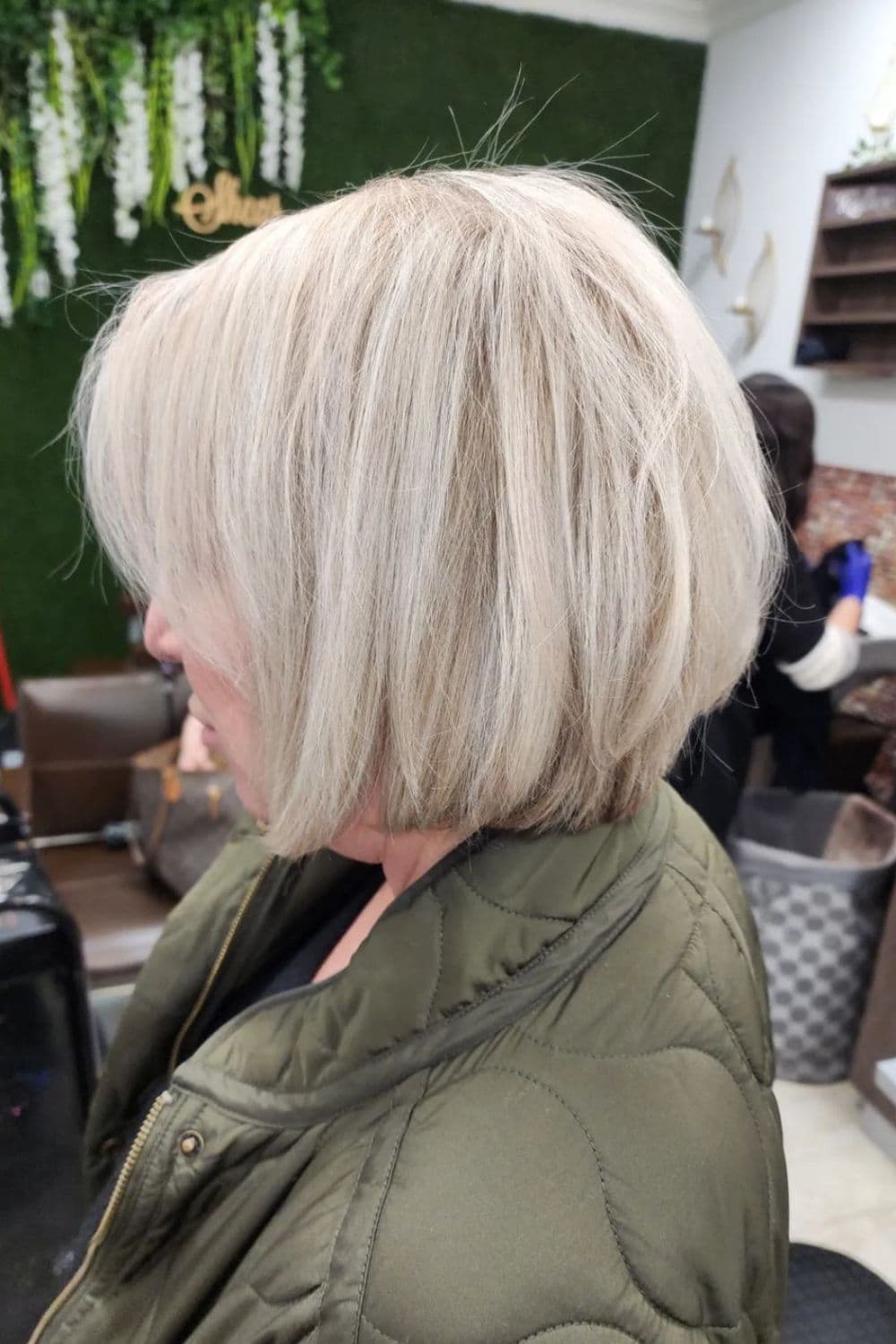 A woman with a white rounded bob cut.