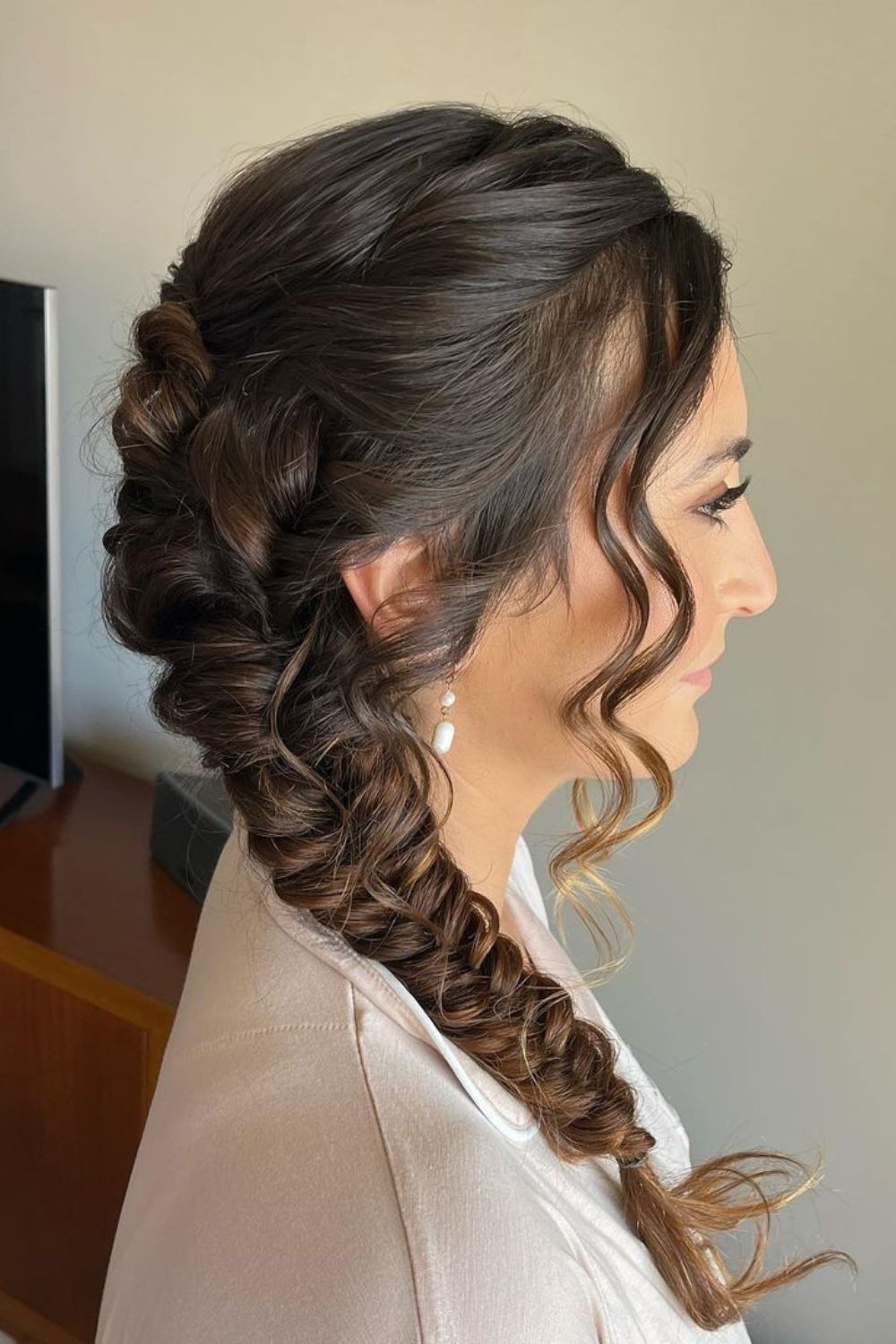 A woman with a side braid.