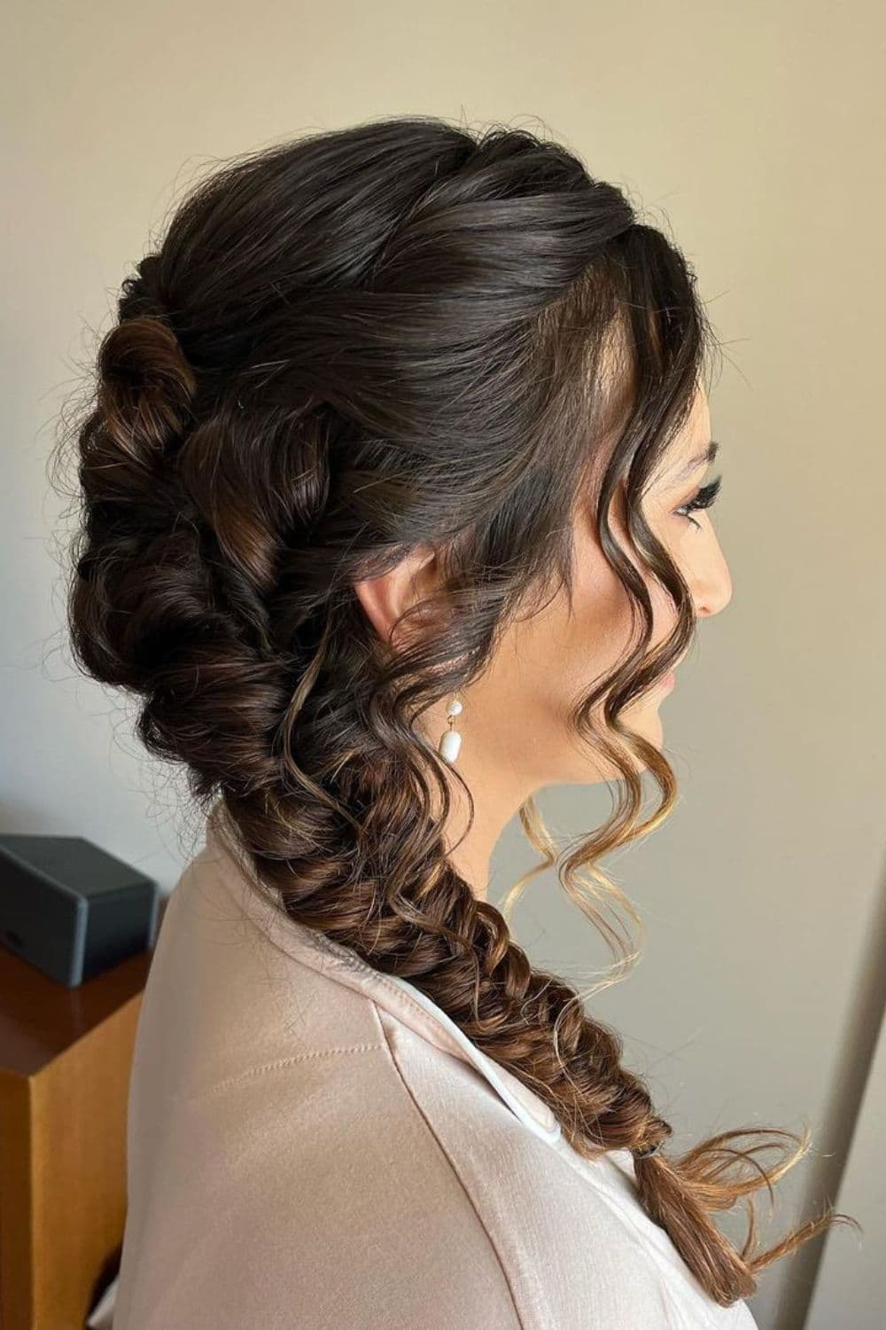 A woman with a brown side braid.