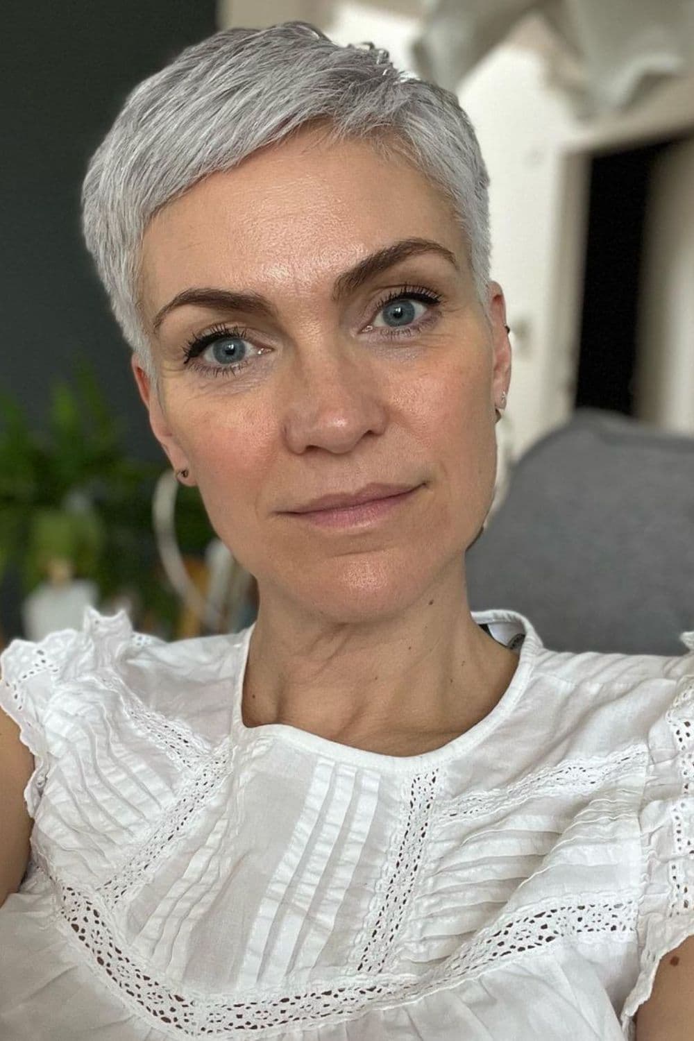 A woman with a silver pixie cut.