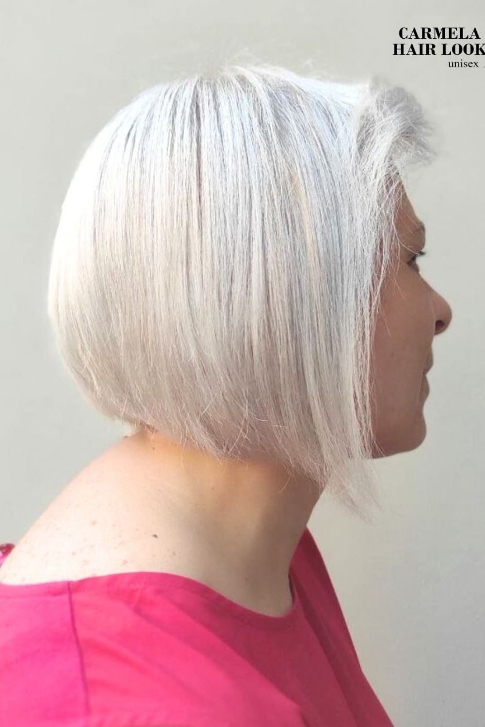A woman with a white stacked bob.