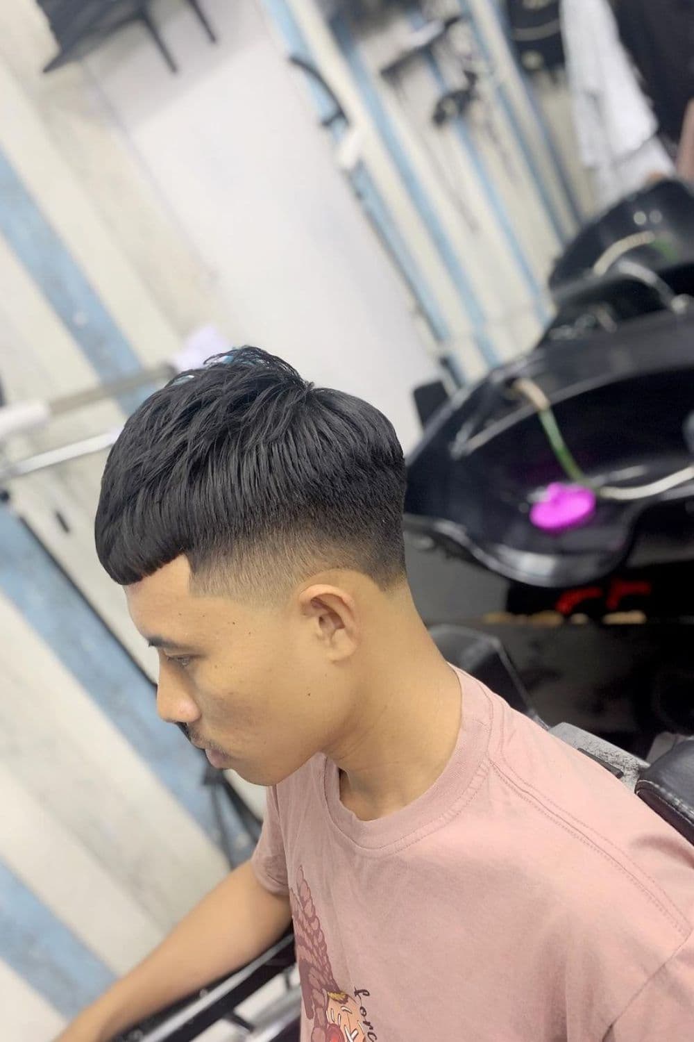 A man with a taper fade French crop.