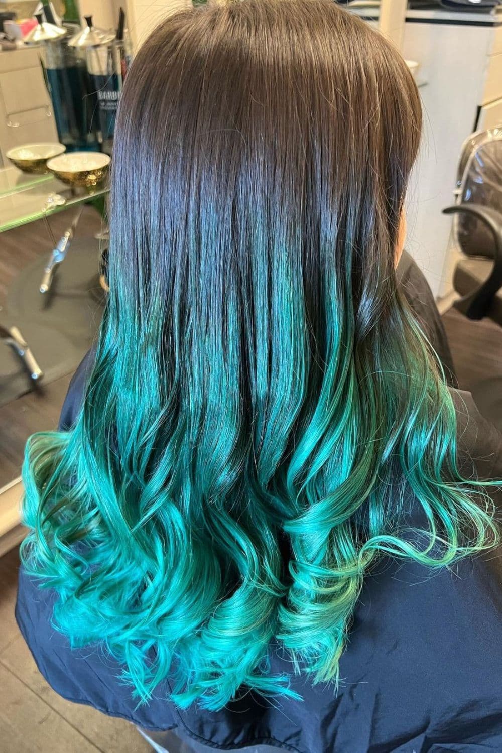 A woman with a teal ombre hair.