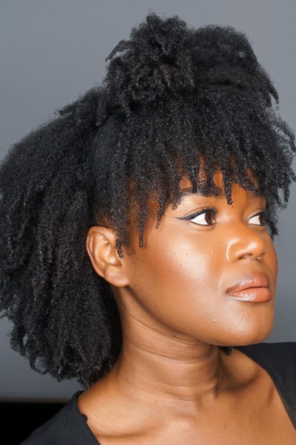 A woman with a 4C wash 'n' go hairstyle.