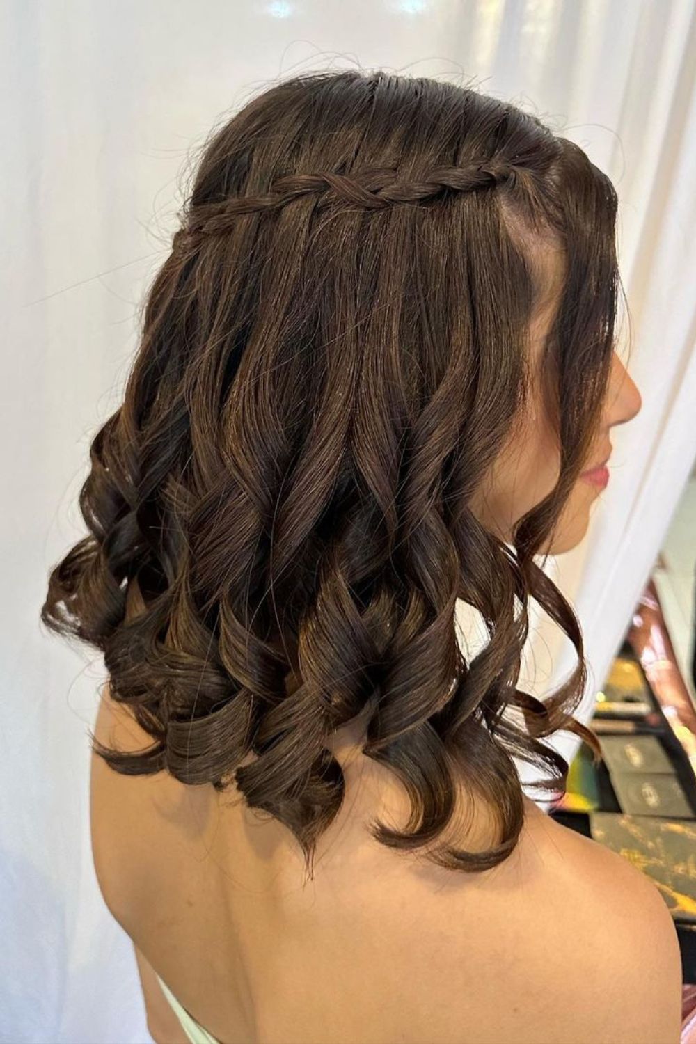 A woman with a black waterfall braid.