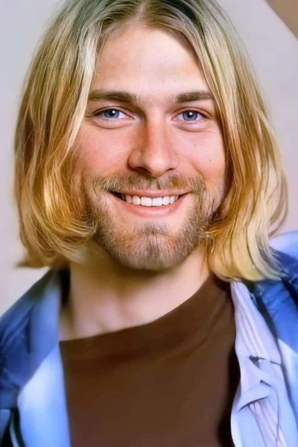 A man with a blonde 90s grunge hairstyle.