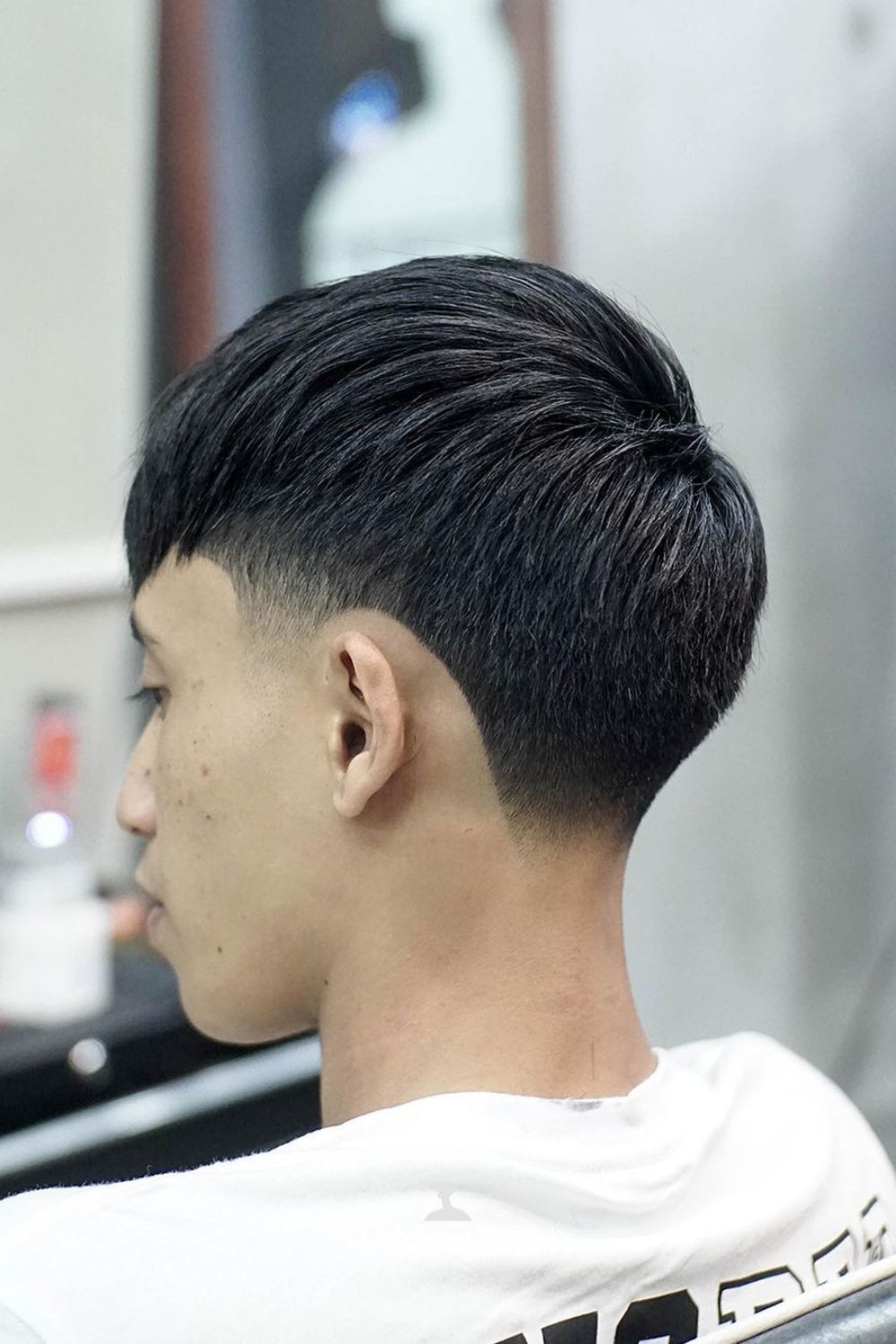 A man with a French crop taper fade.