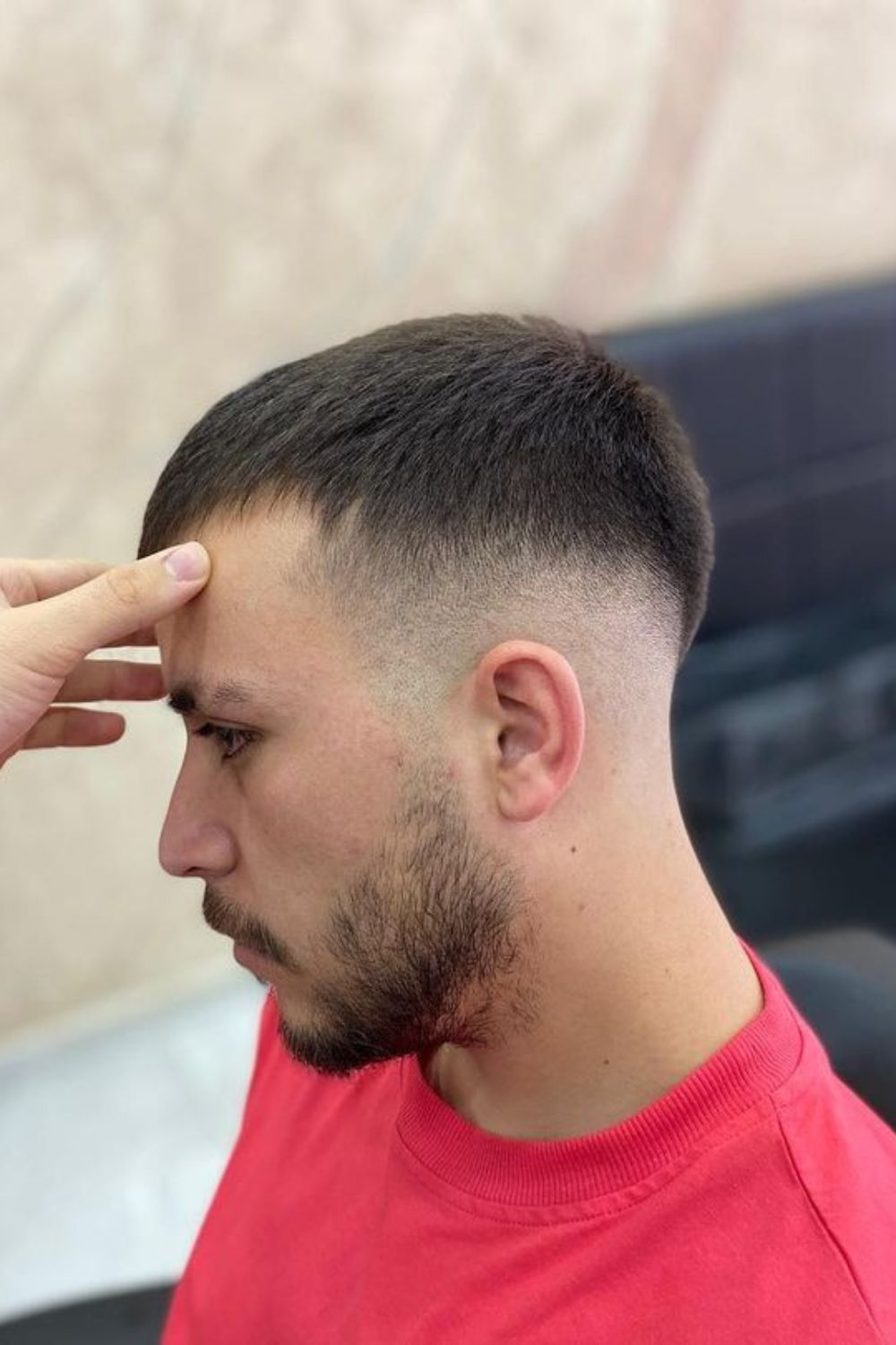 A man with a high fade crew cut.