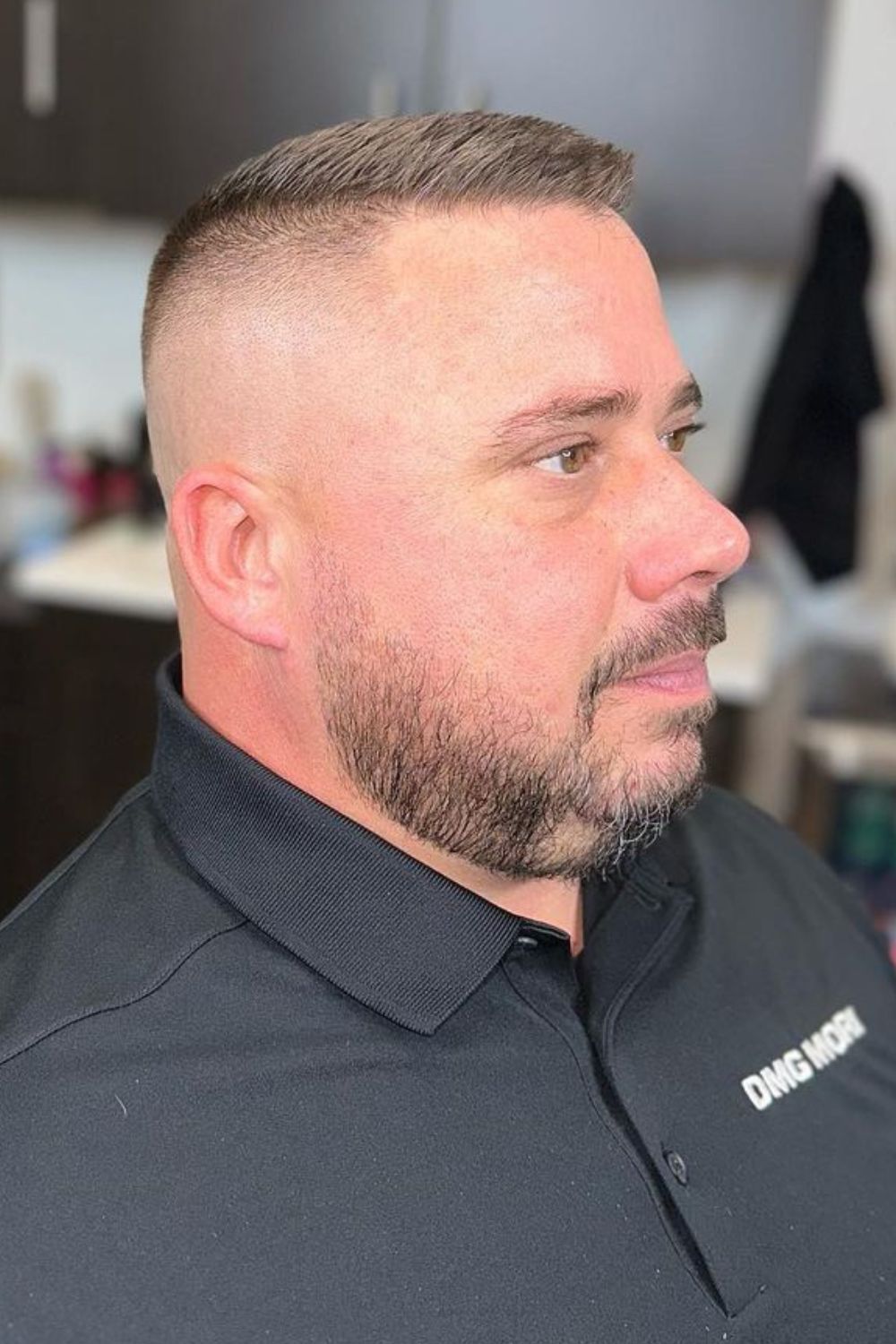 A man with a high and tight crew cut.