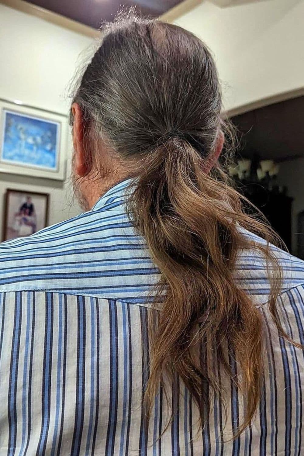 A man with a long ponytail.
