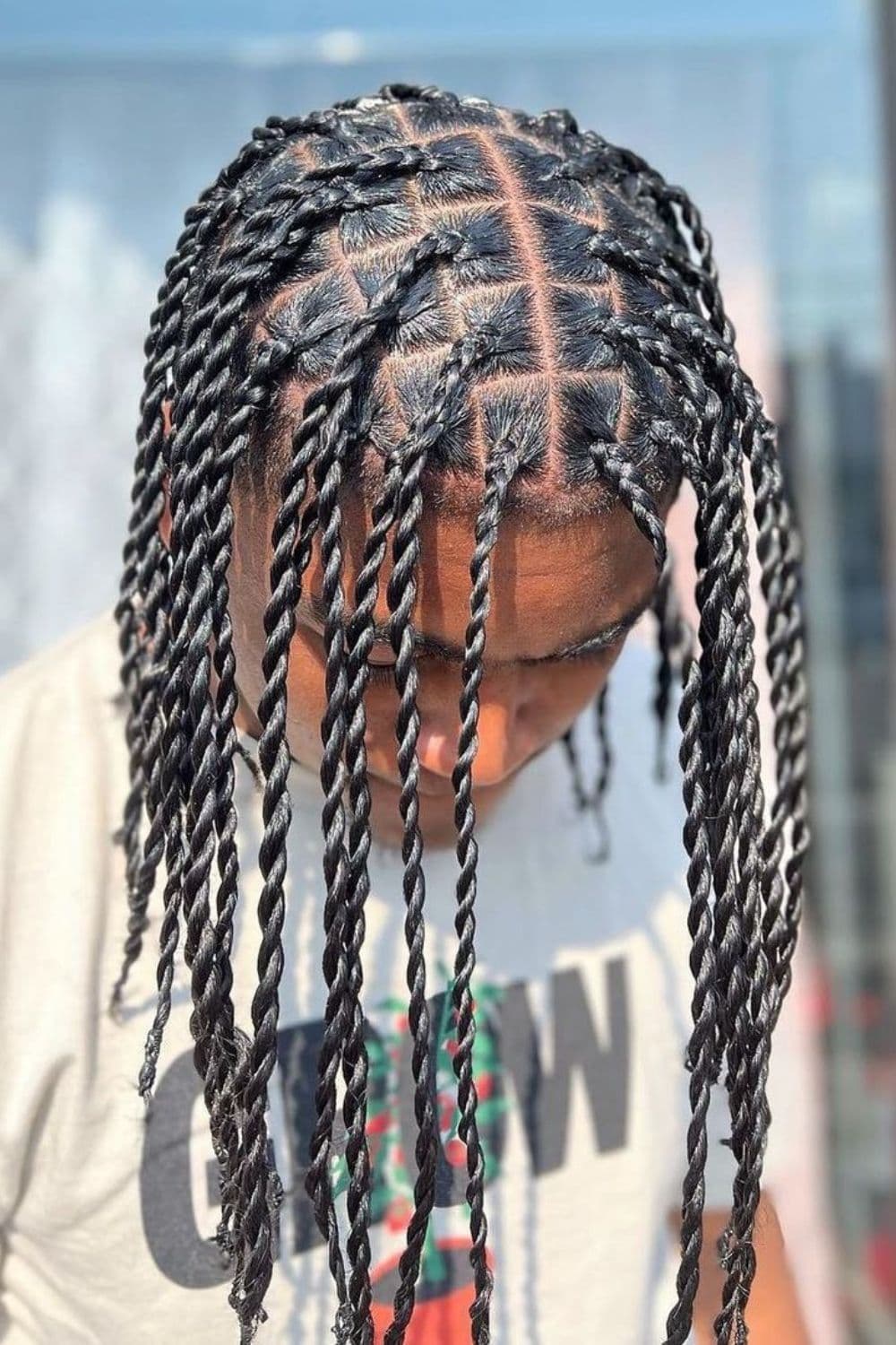 A man with long twists.