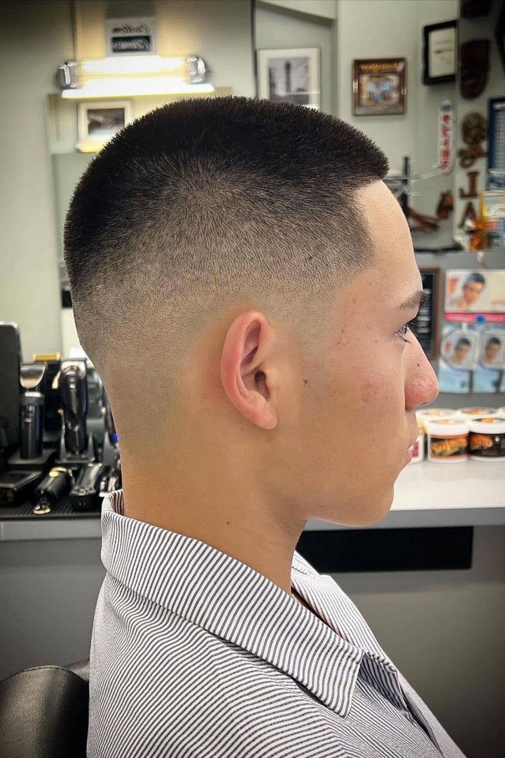 A man with a mid fade buzz cut.