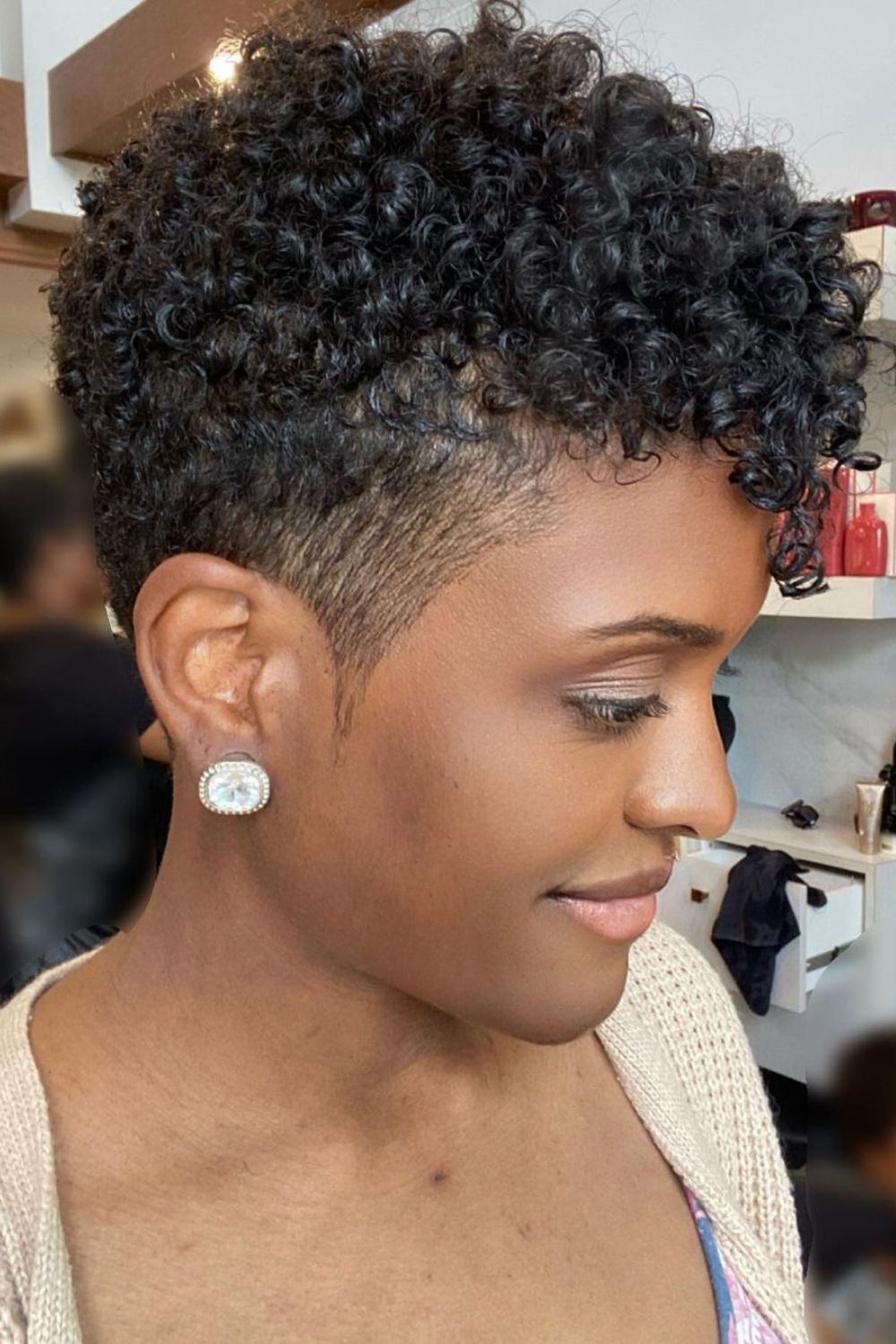 A black woman with a tapered pixie cut.