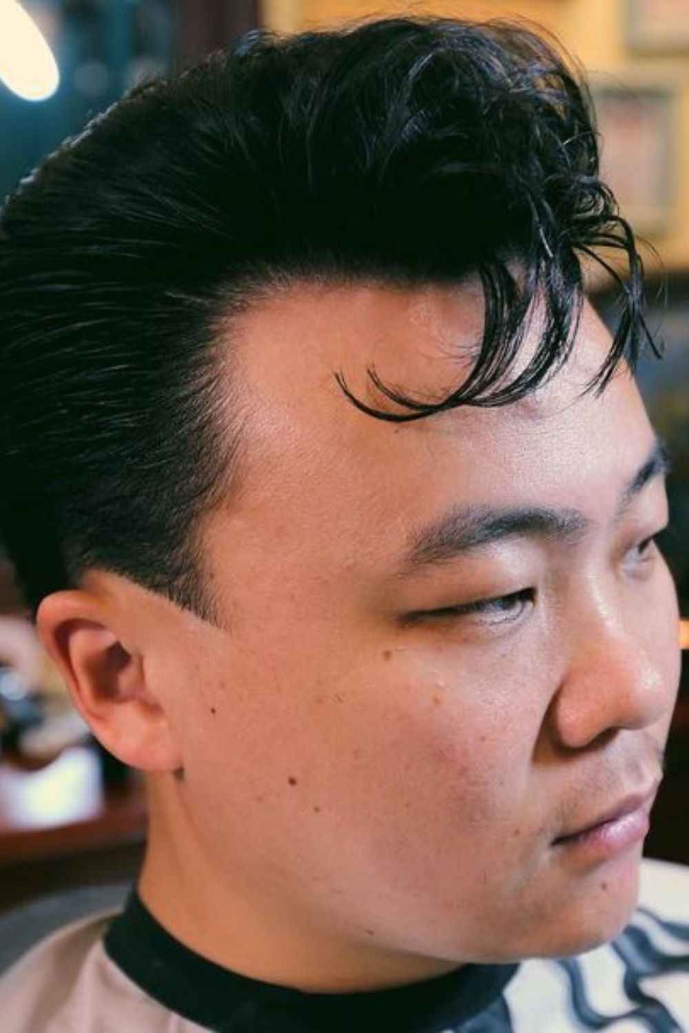 A man with a tapered pompadour.