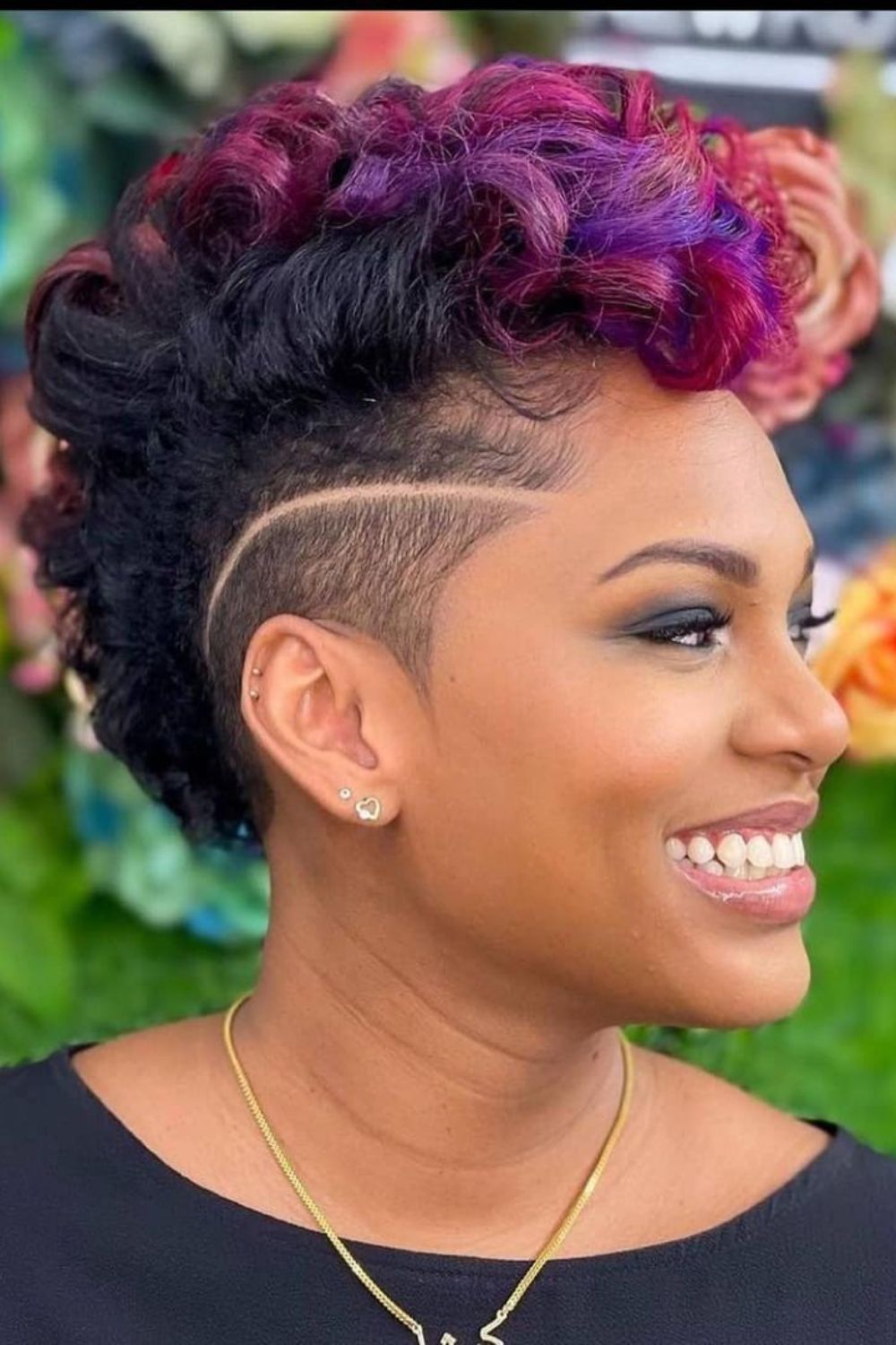 A black woman with a tapered undercut.
