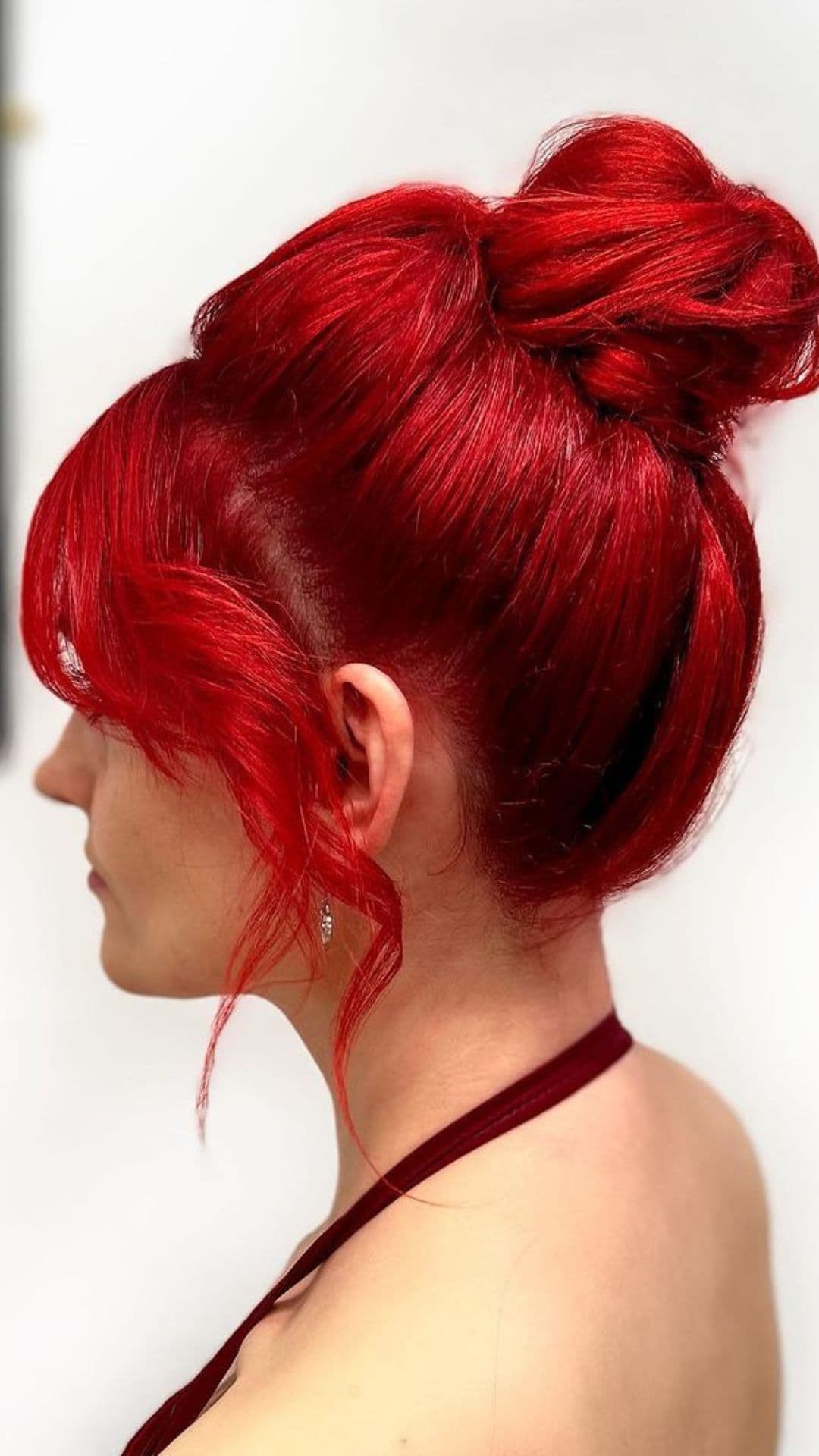 A woman with a red hair updo.