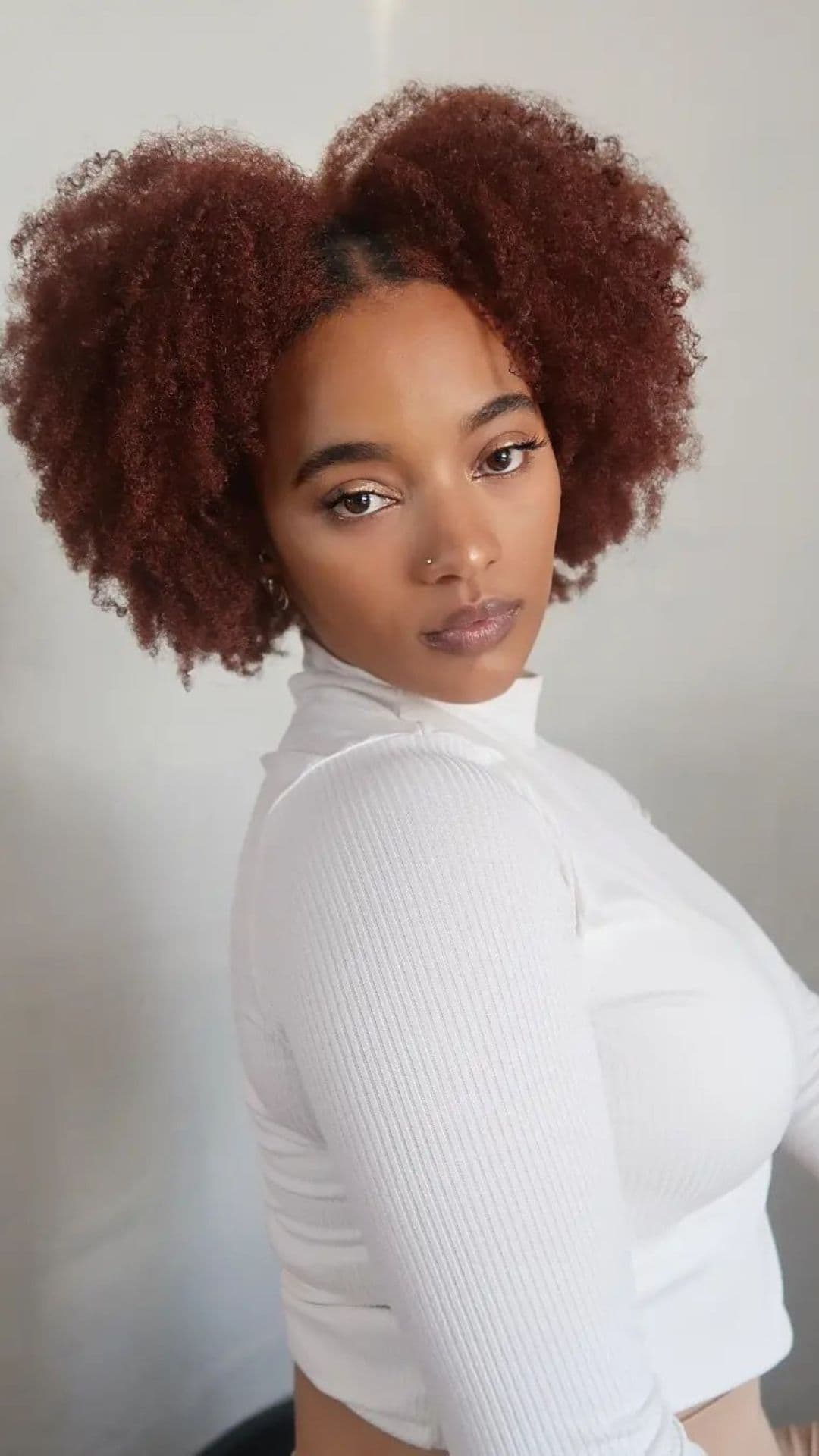 A woman with a textured natural hair.