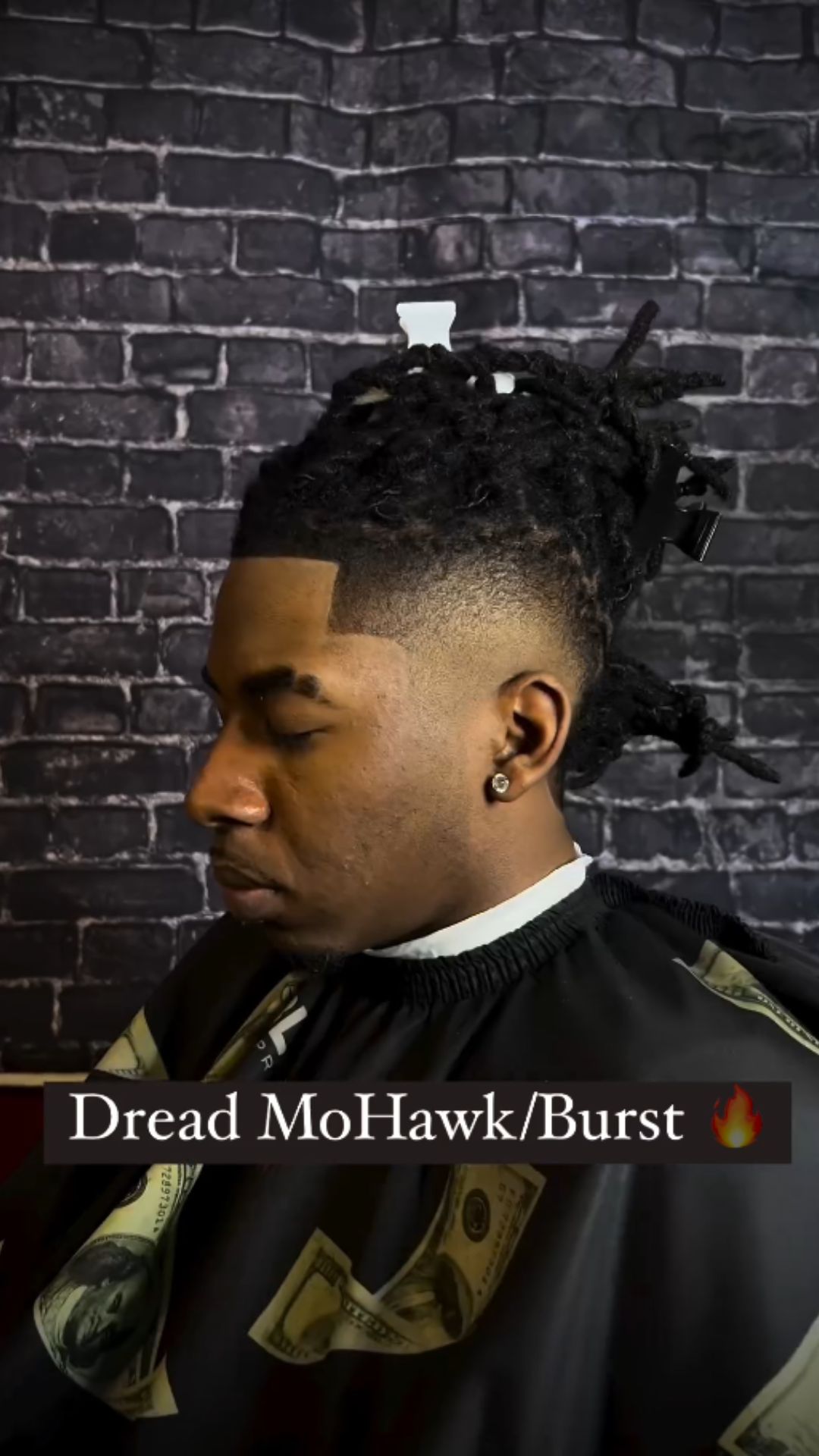 A man with burst fade dreads.