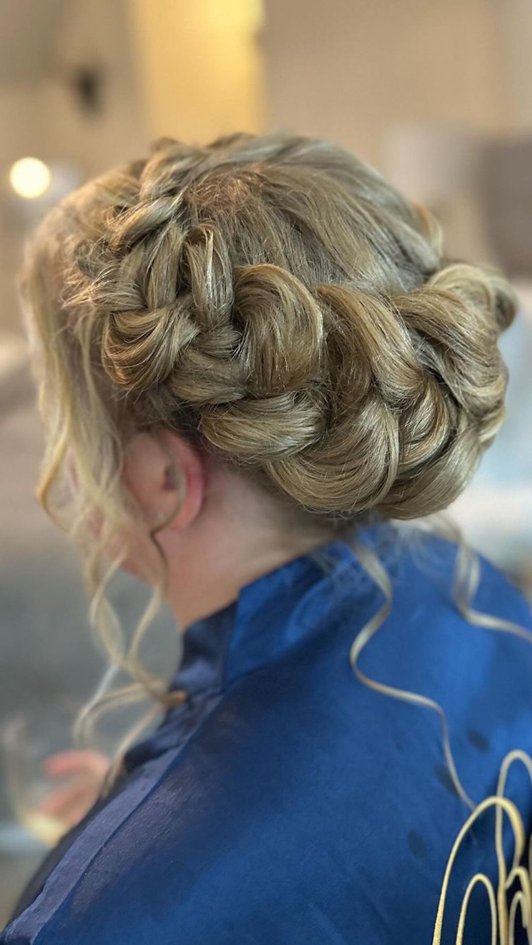 A woman with a blonde crown braid.