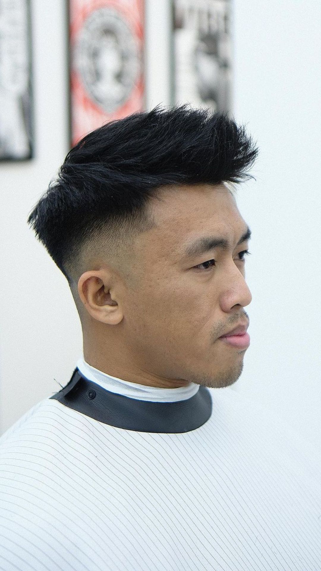 A man with a faux hawk and textured fringe.