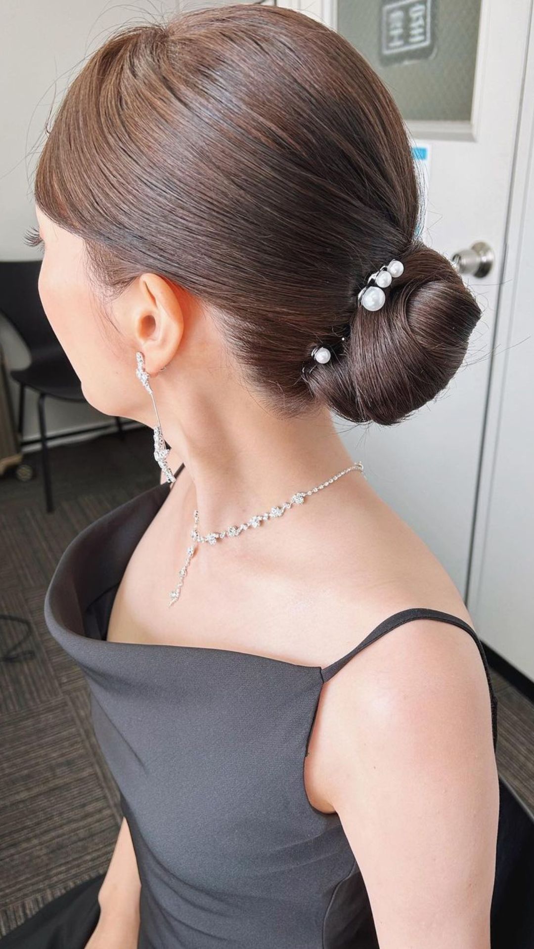 A woman with low chignon.