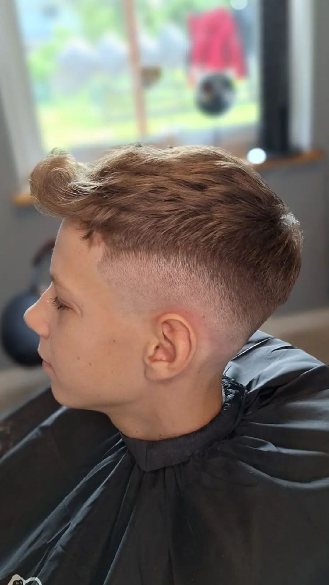 A boy with a modern quiff haircut.