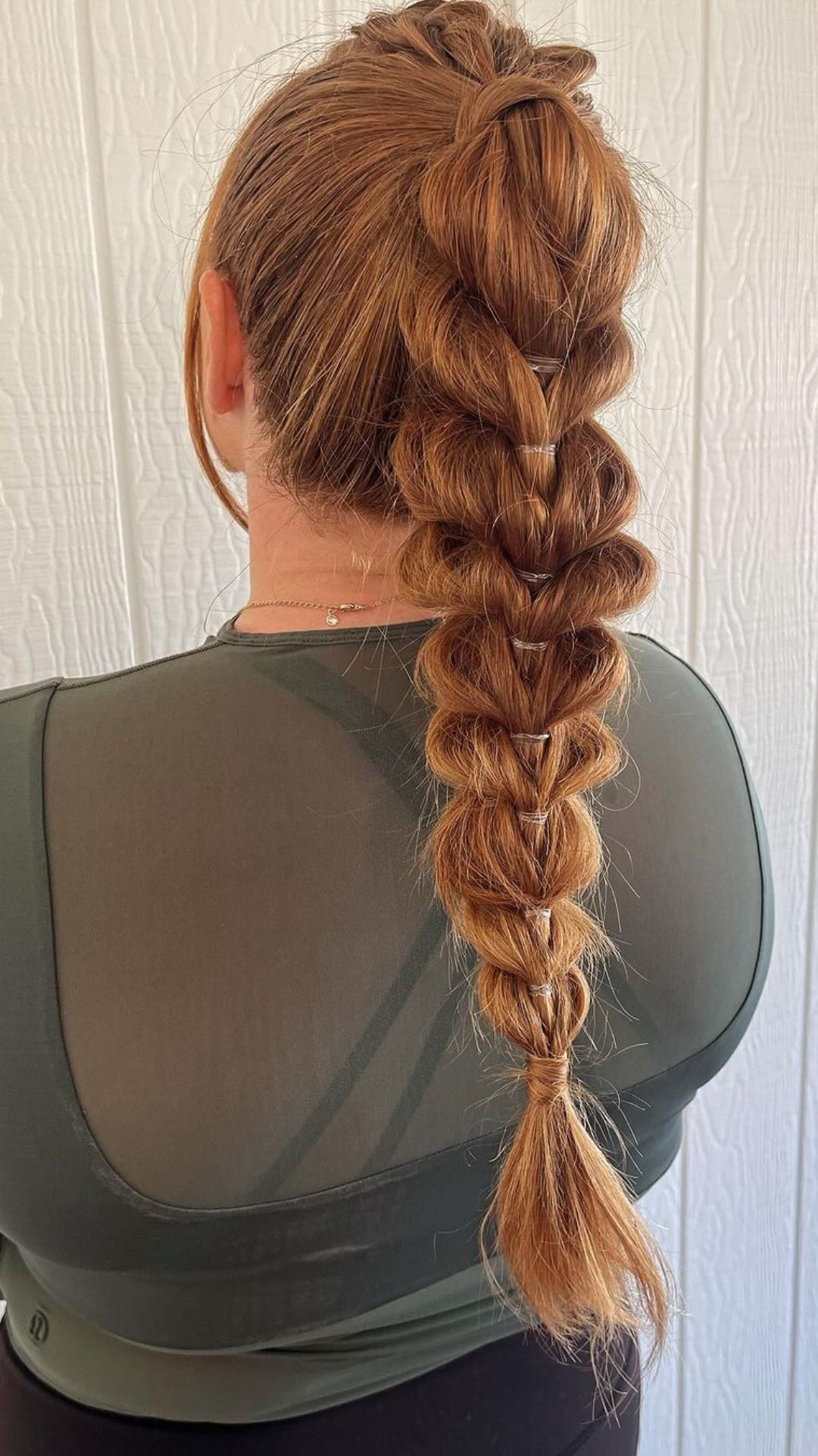 A woman with pull through braid ponytail.