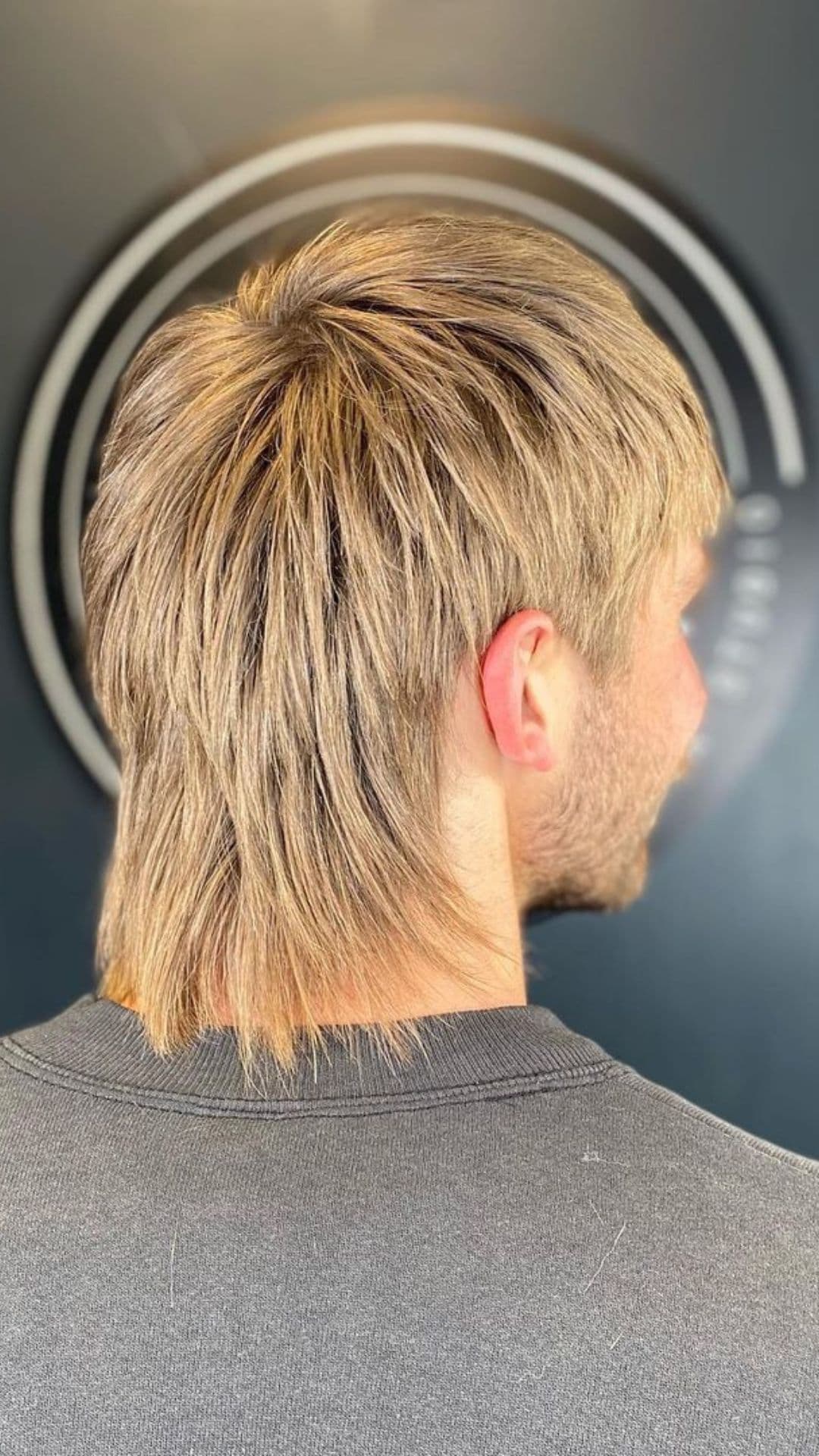 A man with a blonde razor cut mullet.