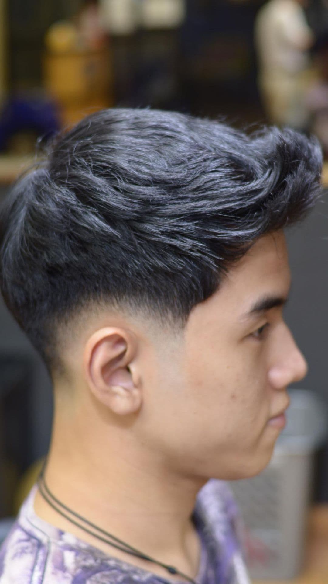 A man with textured spikes haircut.