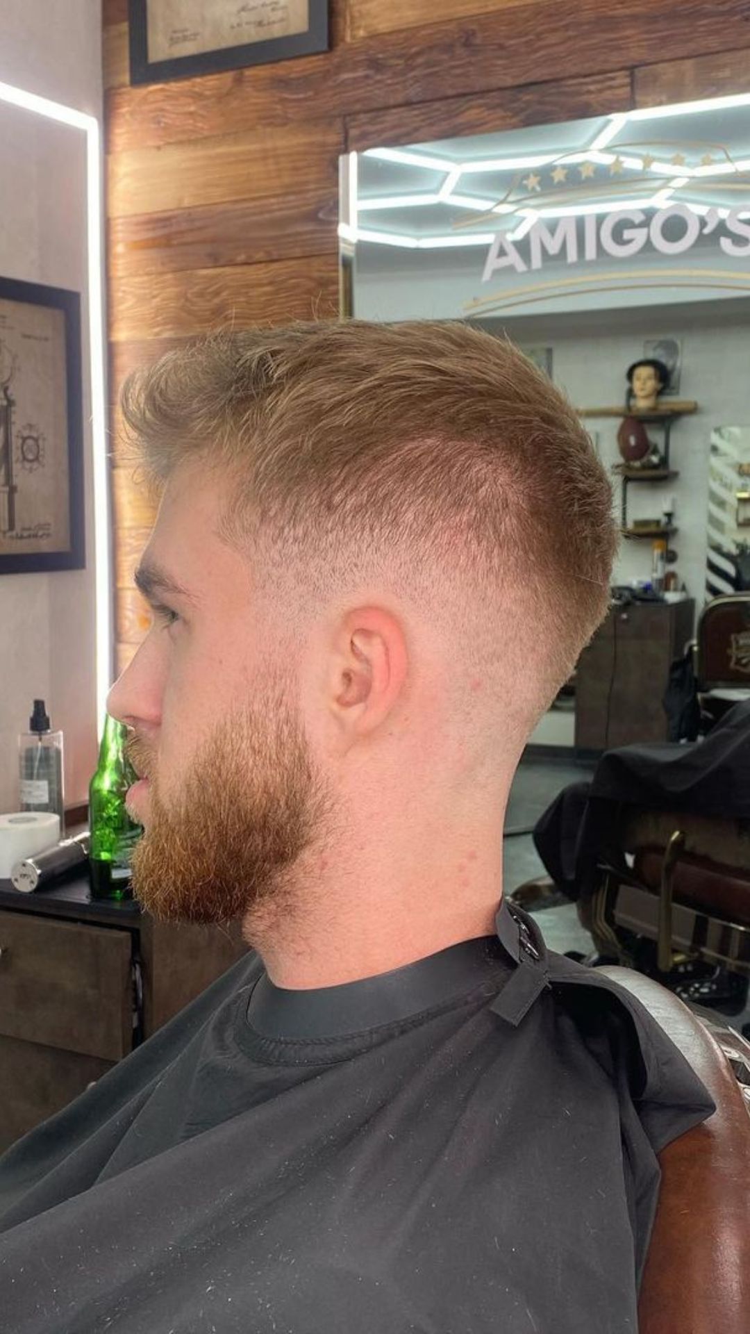 A man with a blonde undercut with a textured fringe.