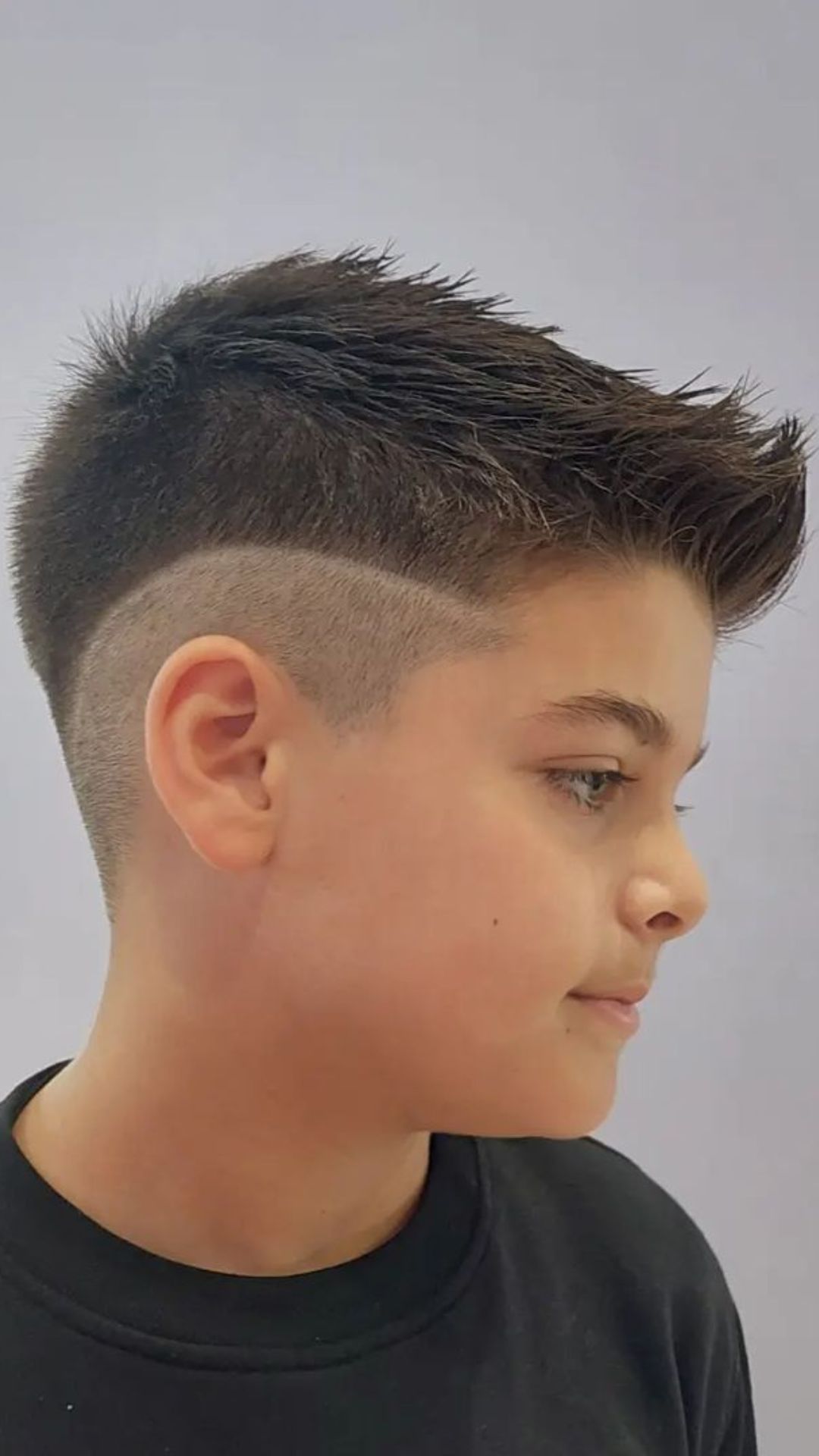 A boy with an undercut hair.