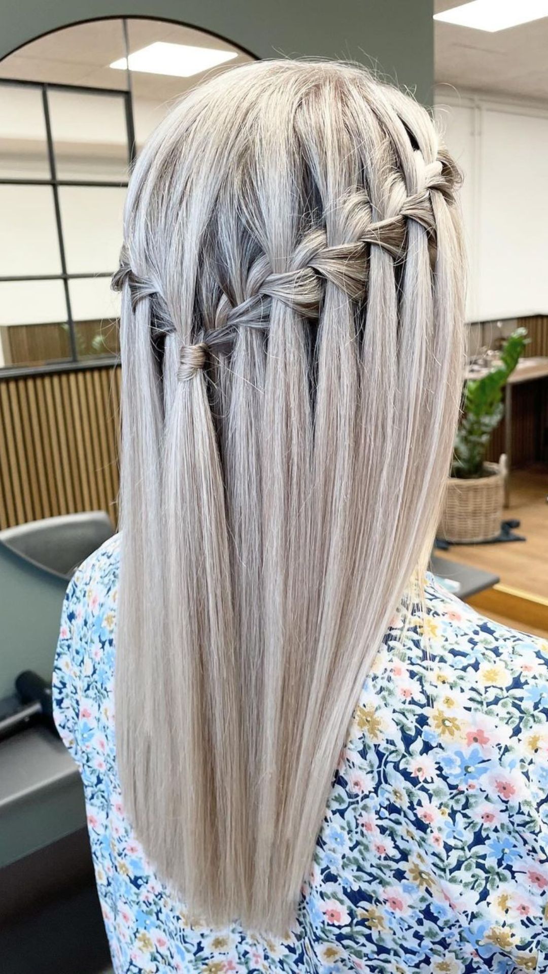 A woman with blonde waterfall braid.