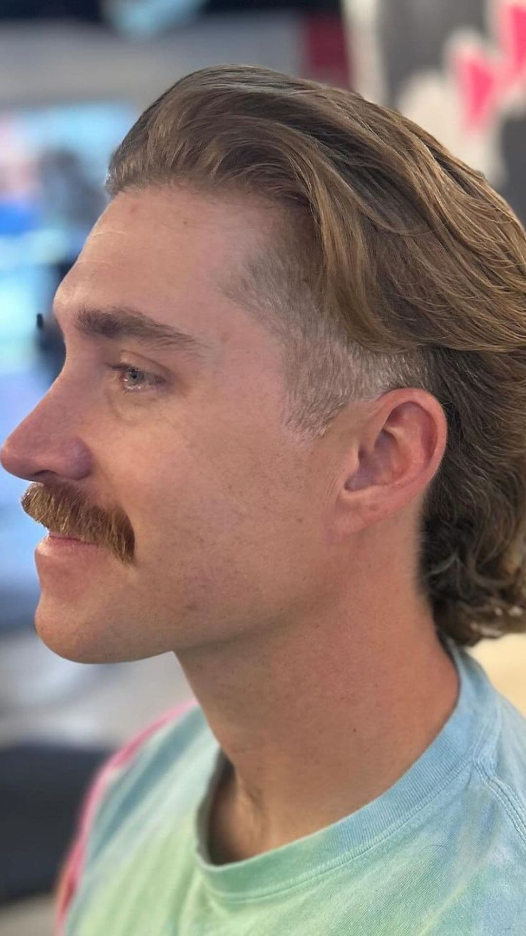 A man with a wavy mullet.