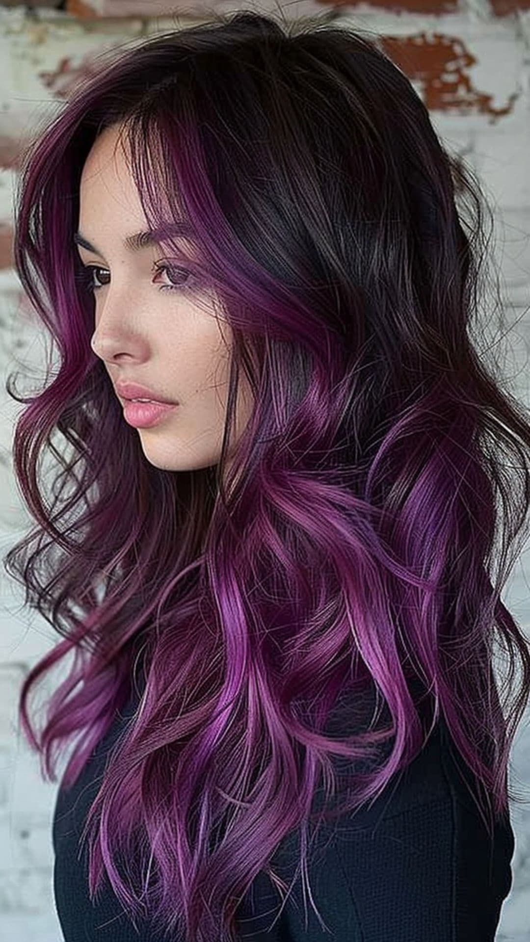 A woman modelling a berry ombre hair.