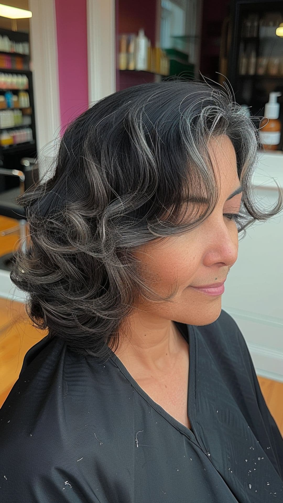 An older woman modelling classic lob with vintage waves hairstyle.