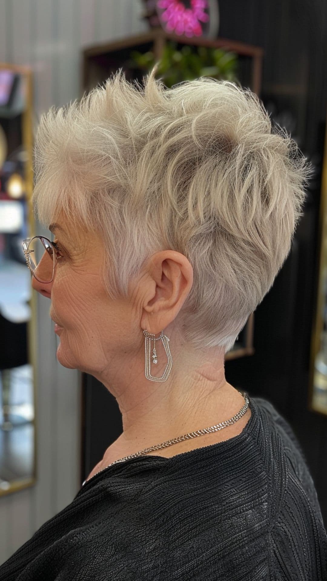 An older woman modelling a classic pixie cut.
