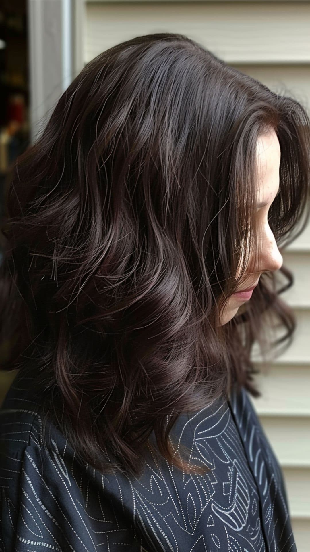A woman modelling a dark brown mocha hair.