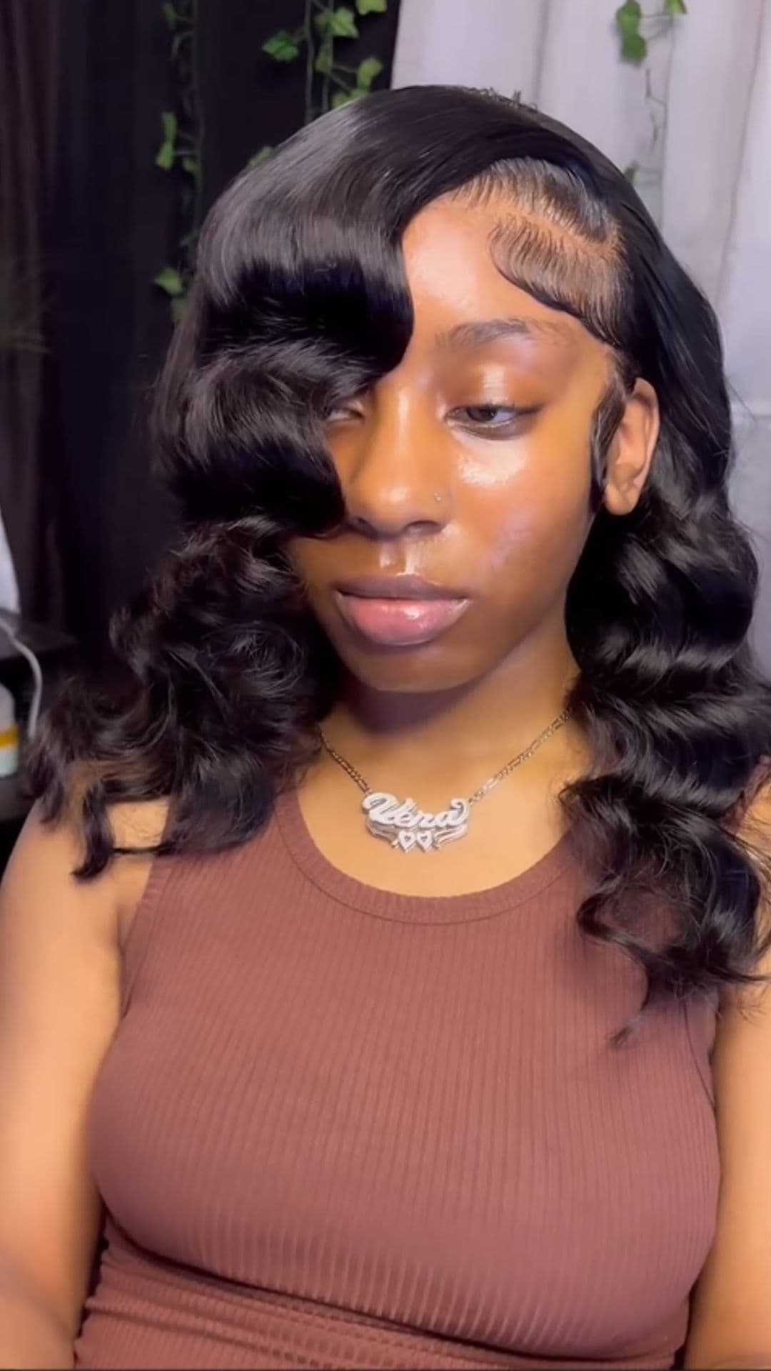 A woman modelling a deep wave hairstyle.