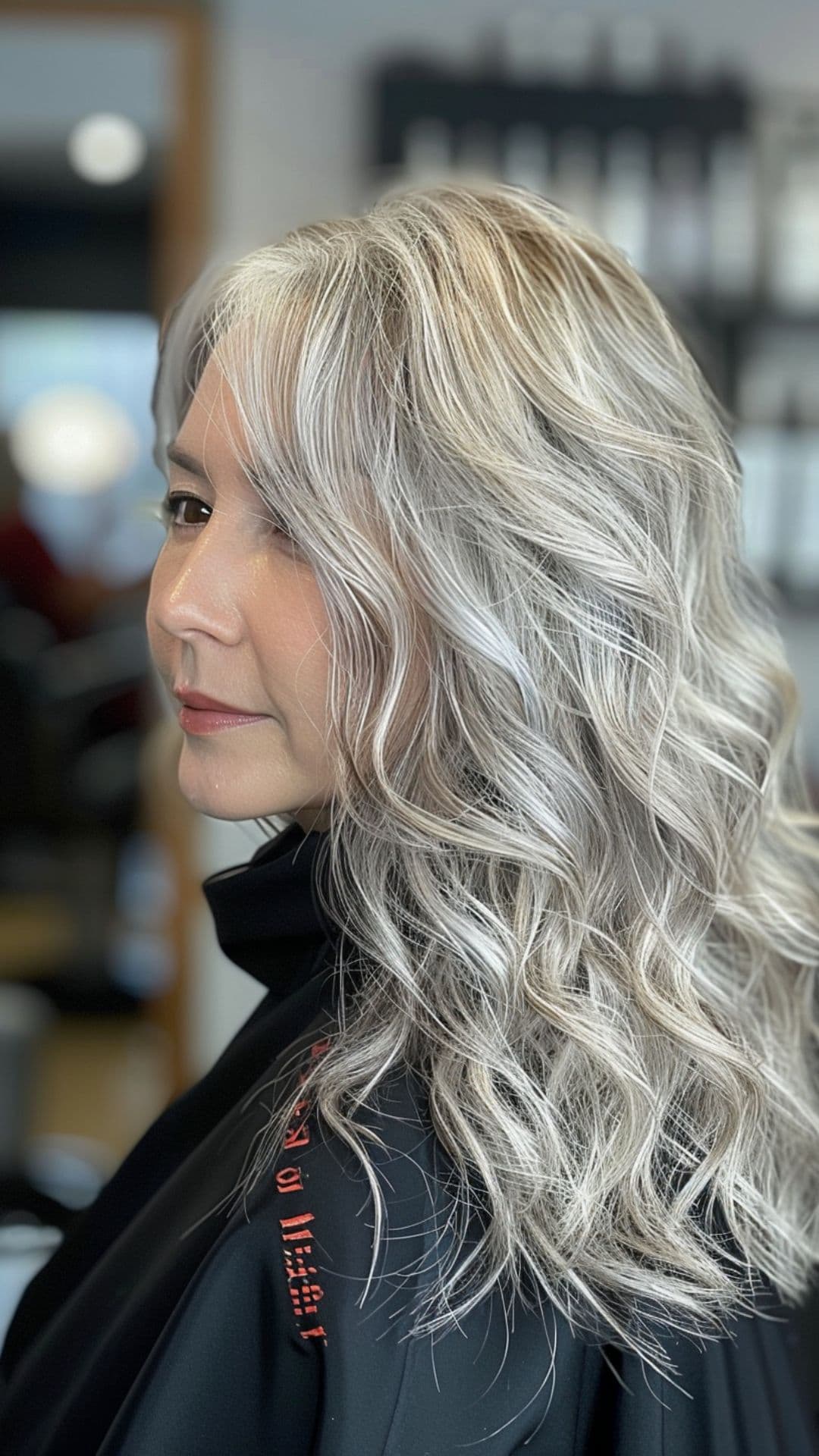 An older woman modelling a layered waves hairstyle.