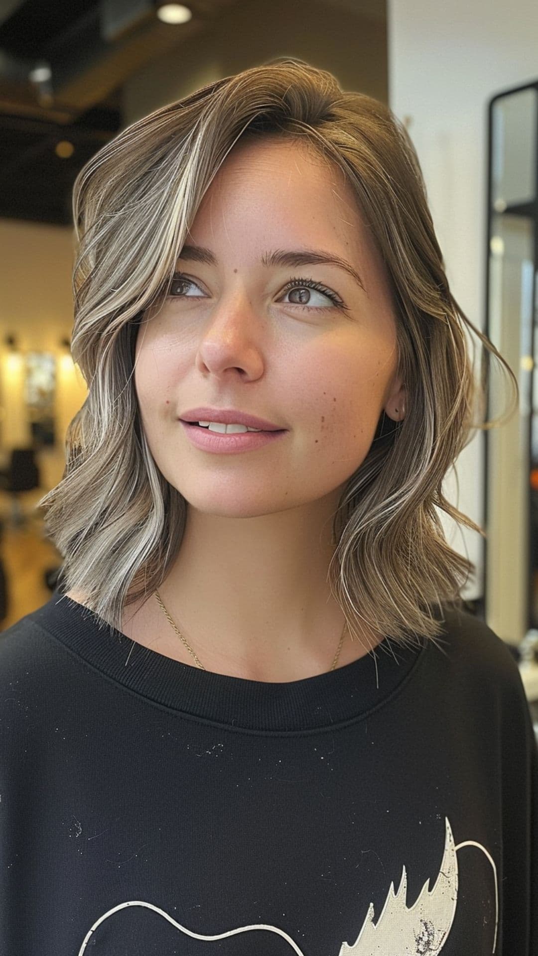 A woman modelling a layered lob with side part.