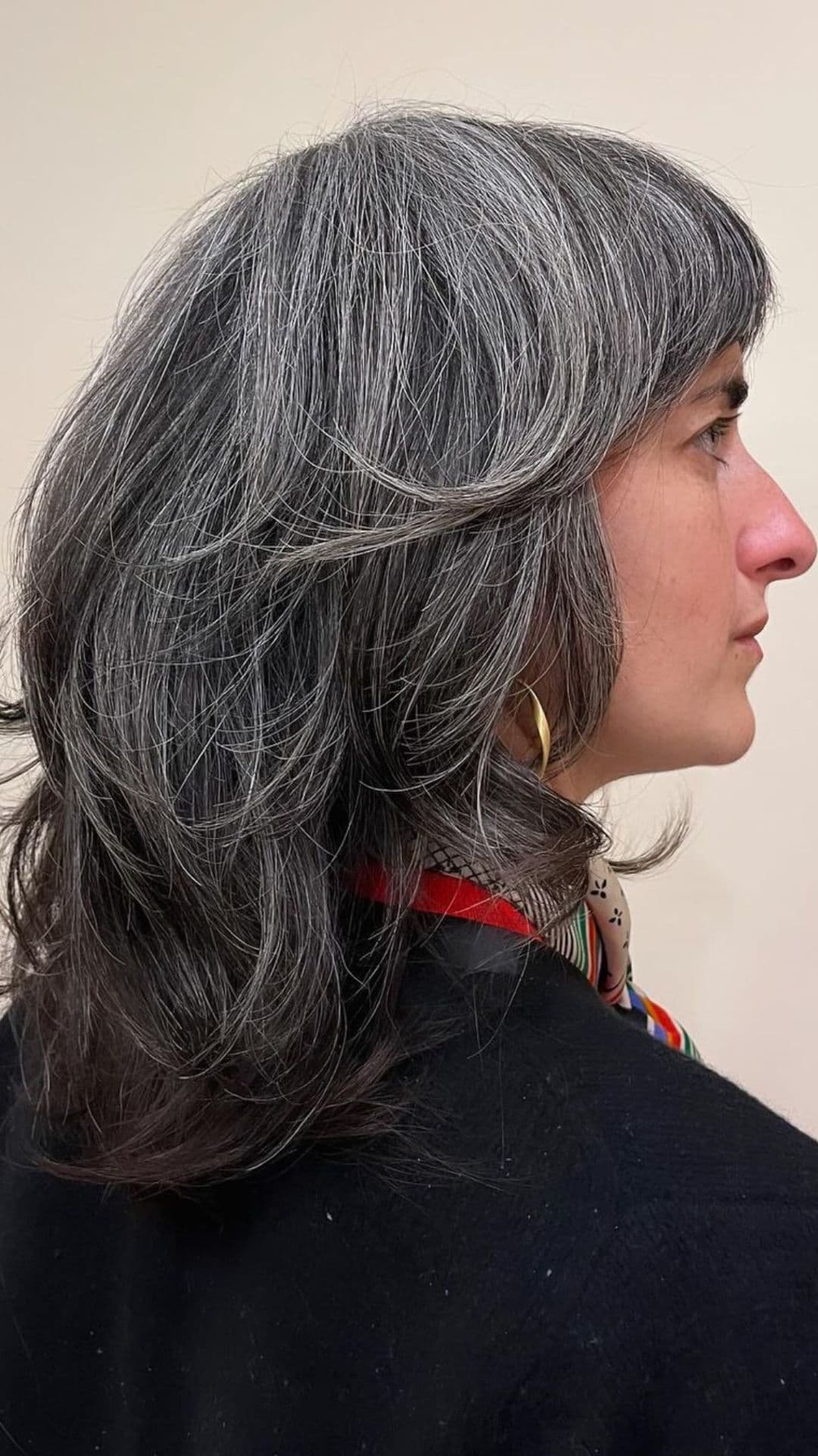 An older woman modelling a layered shag hairstyle.