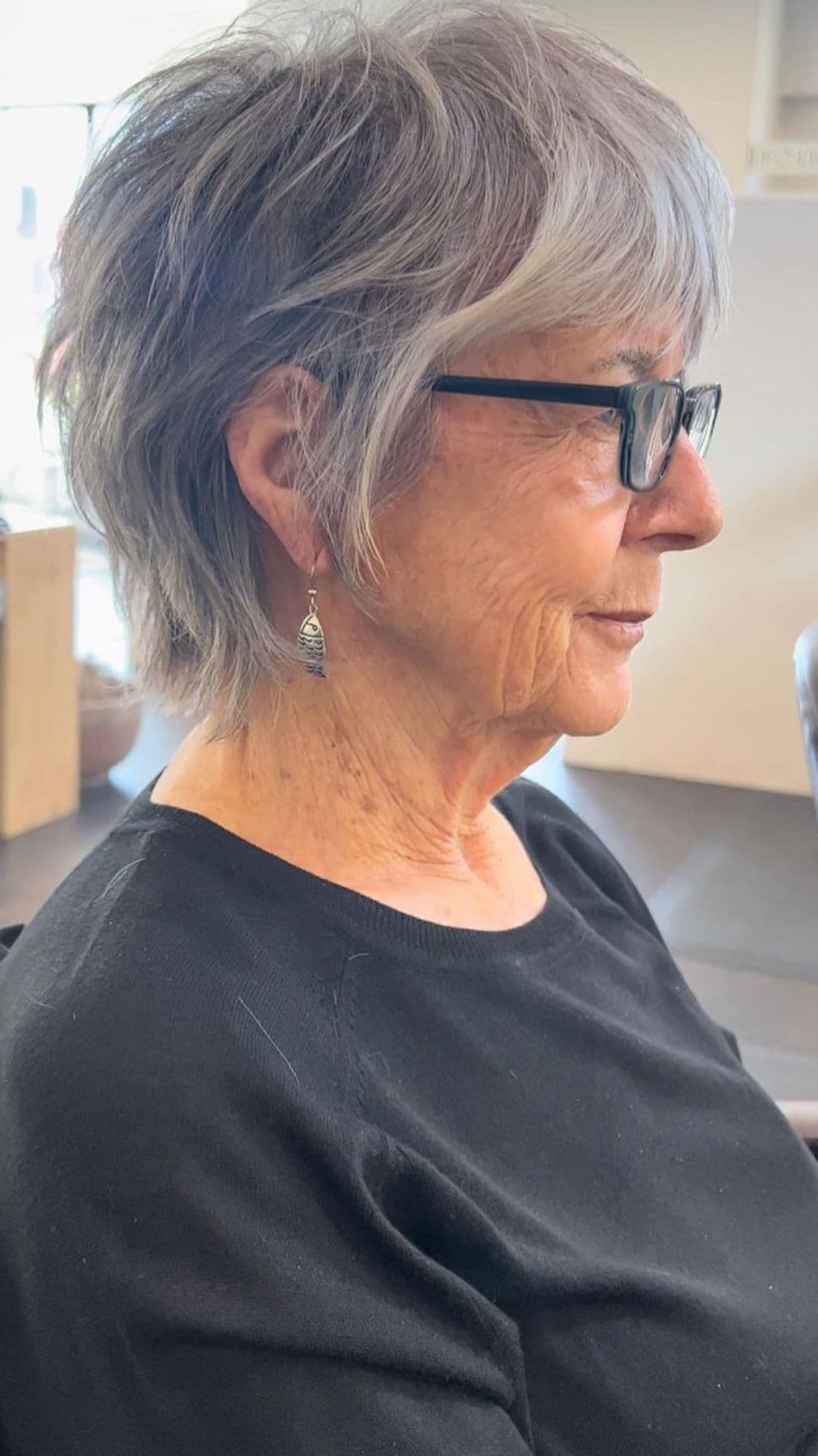 An older woman modelling a pixie shag hairstyle.