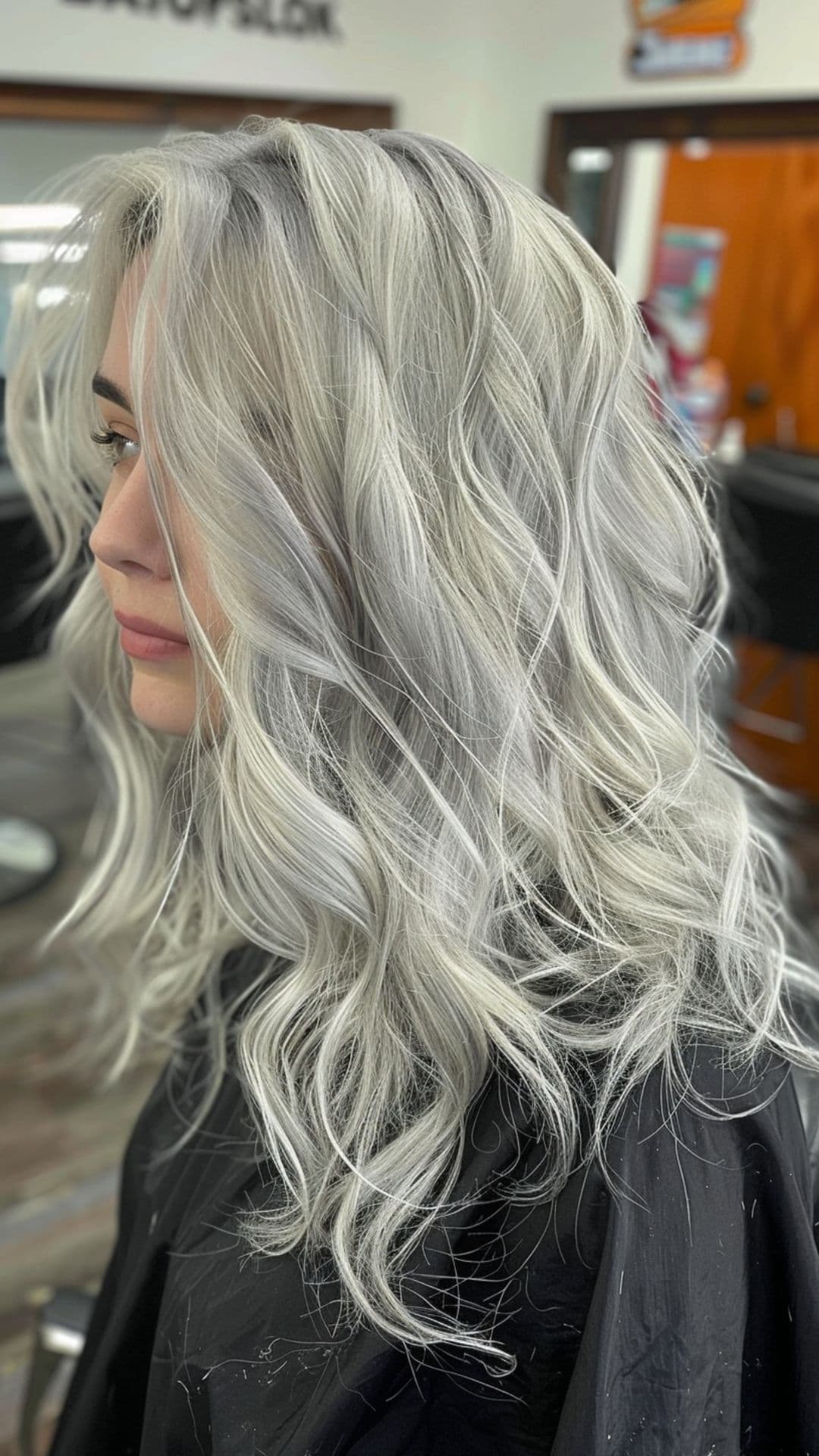 A woman modelling a platinum gray hair.