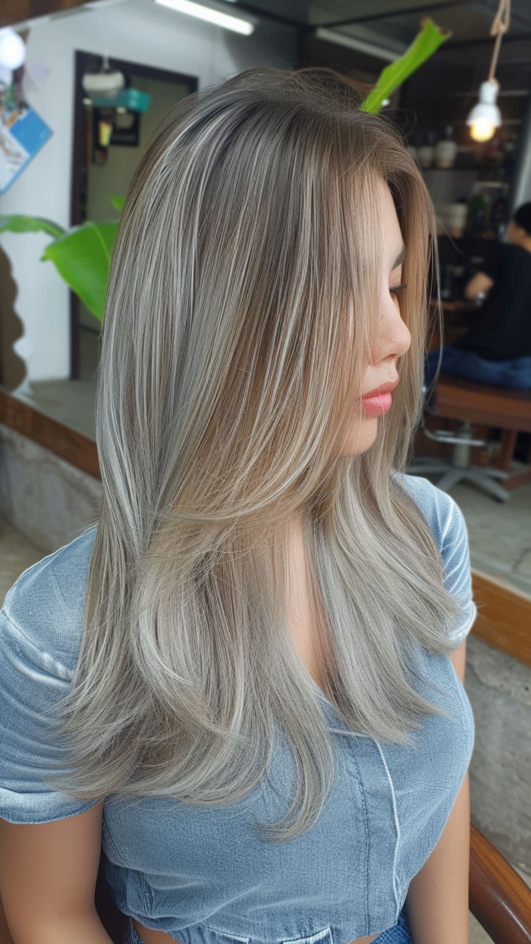 A woman modelling a platinum silver gray highlights.