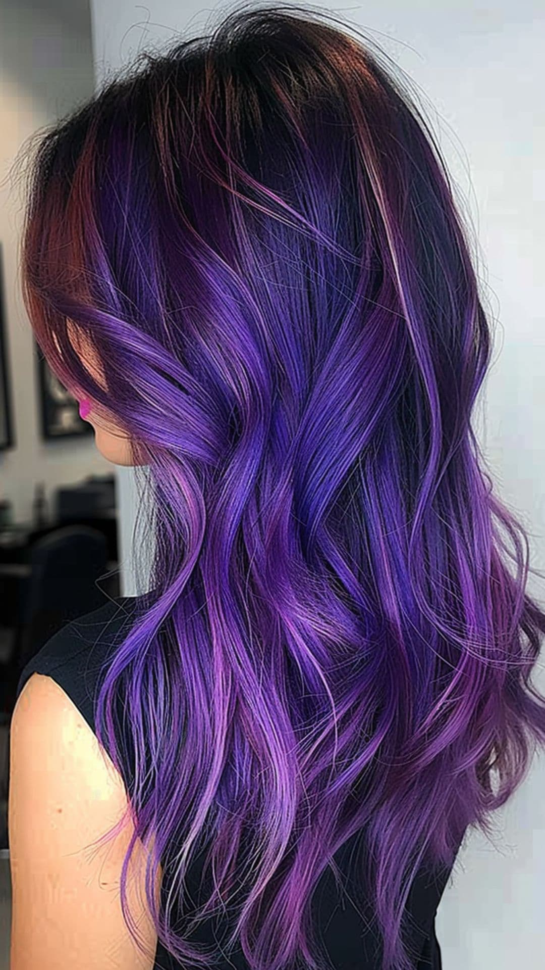A woman modelling a purple gradient hair.