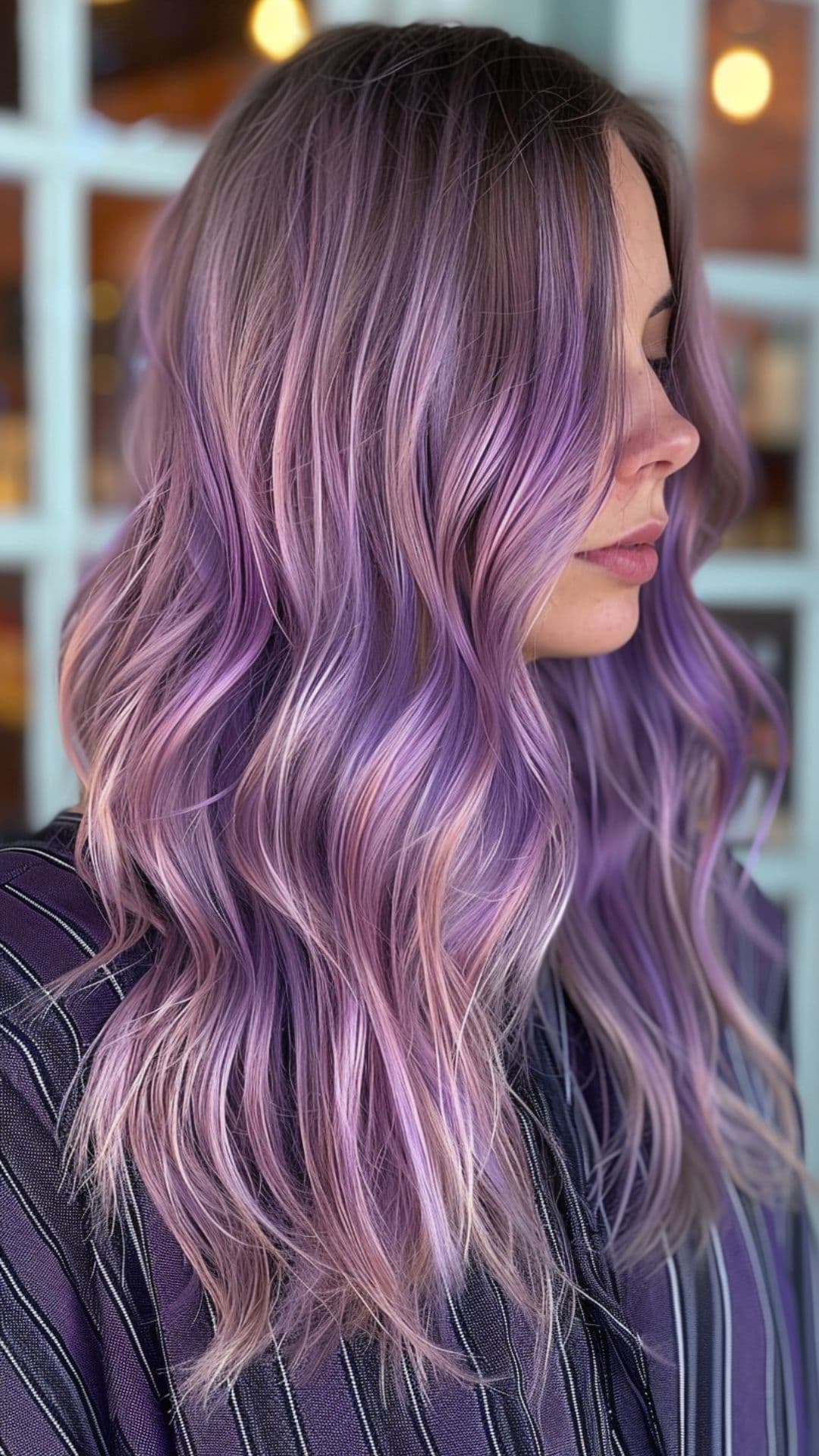 A woman modelling a purple hair with lavender highlights.