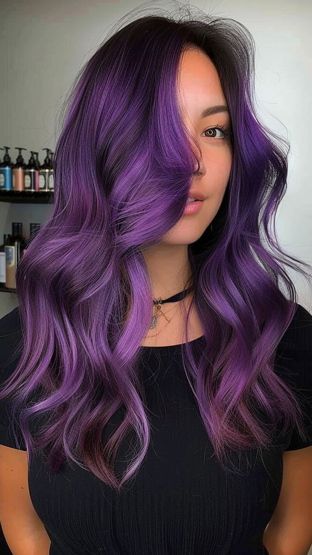 A woman modelling a purple hair with shadow root.